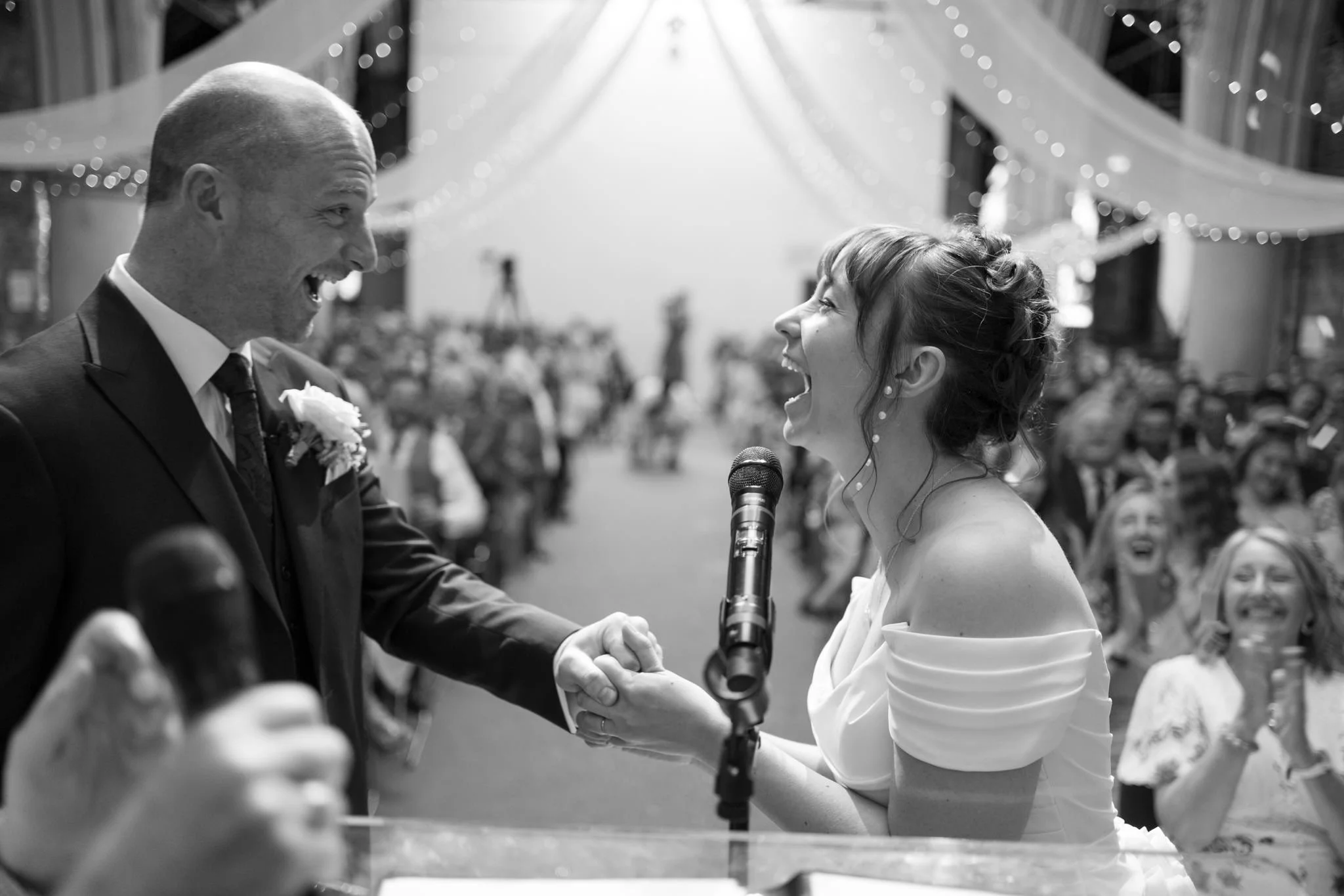 wedding photography of bride and groom celebrating at Woodlands Church in Clifton, Bristol