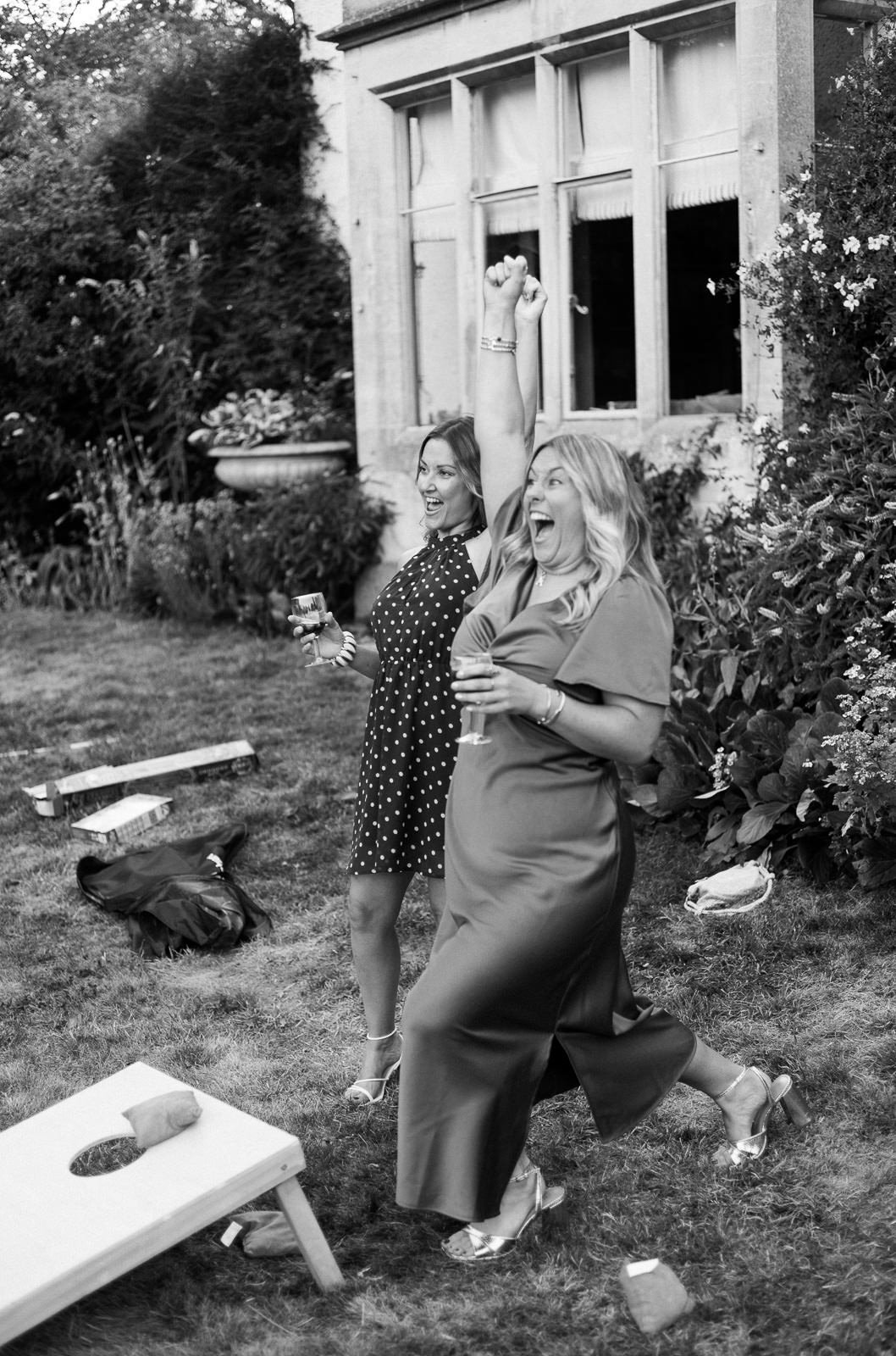 Wedding guests playing cornhole at Matara reception