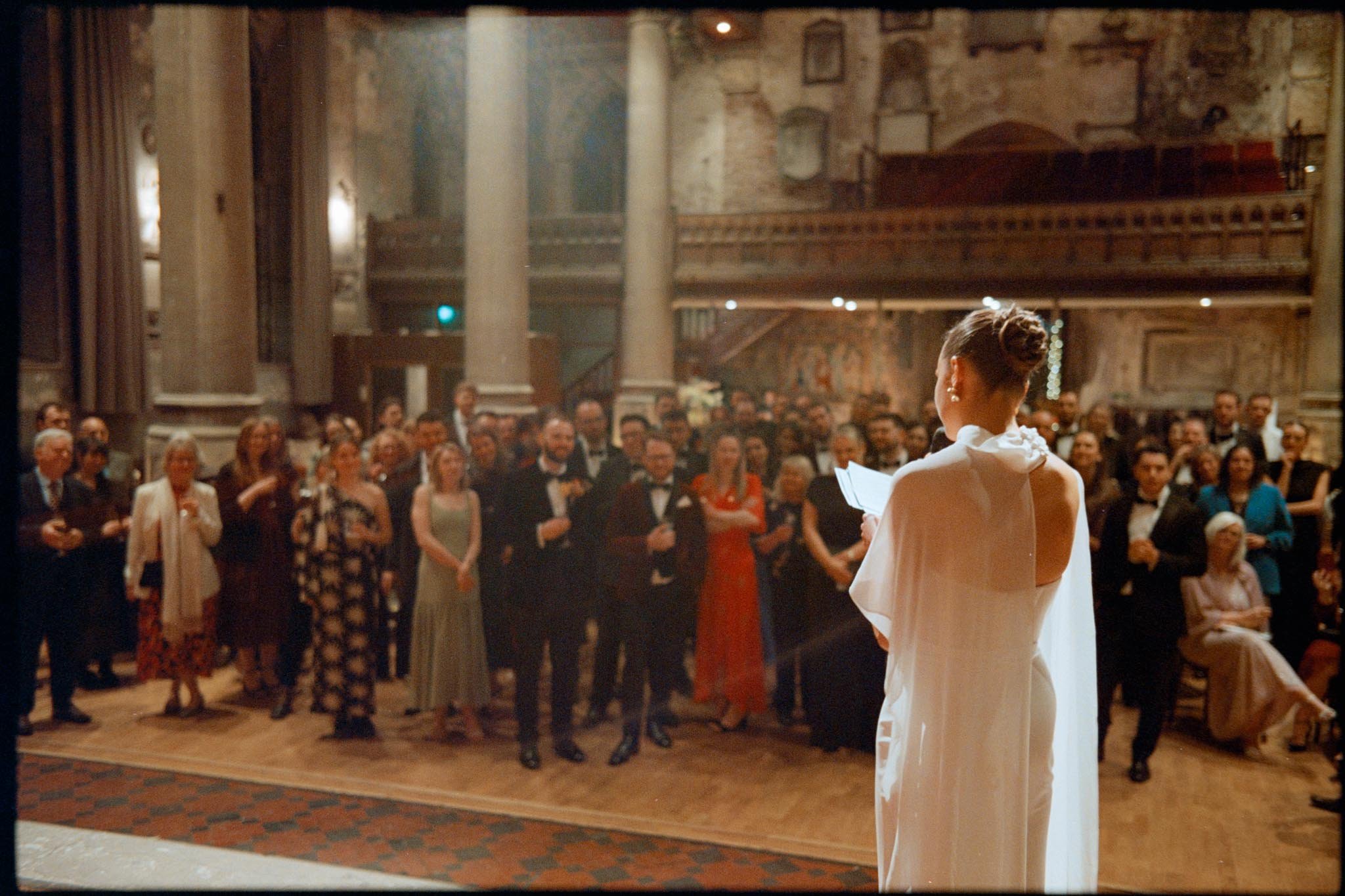Analogue film photograph of a Bride reading her speech to guests at a wedding in Bristol
