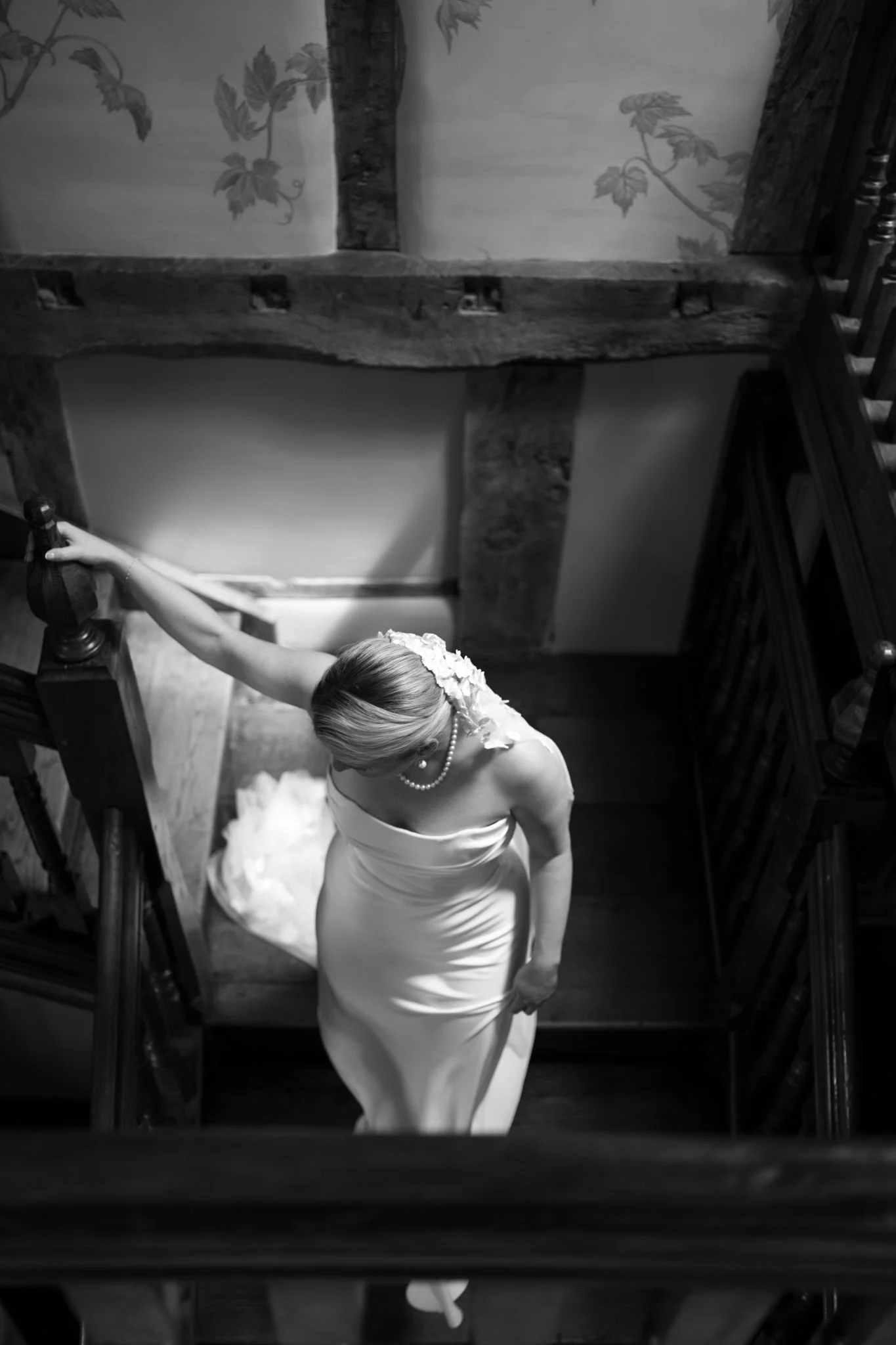 Bride depends the stairs at Dewsall Court