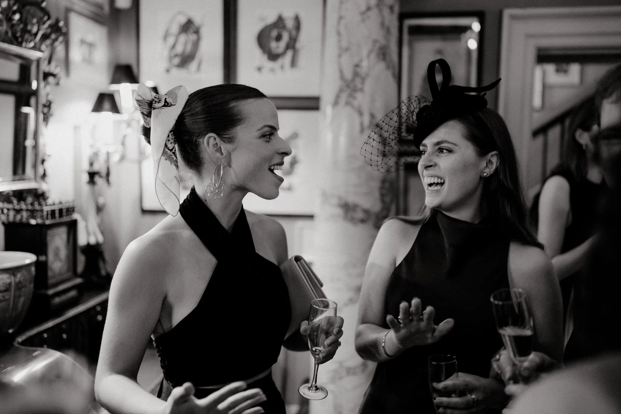 wedding photography of female guests laughing at Brunswick House in London