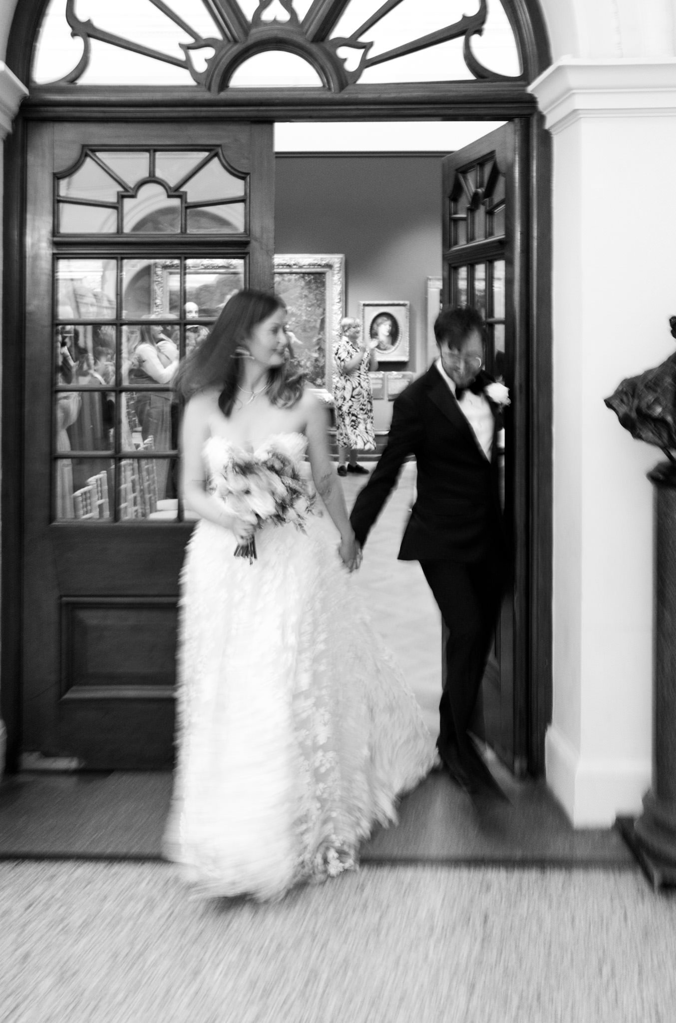 Bride and groom leaving a wedding ceremony at Bristol Museum