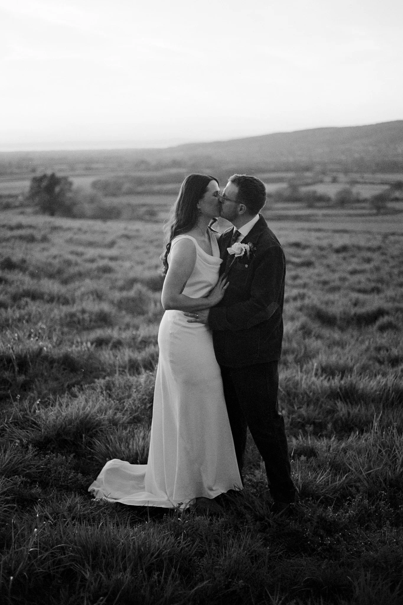 Bride and groom at sunset in black and white at Coombe Lodge in Blagdon