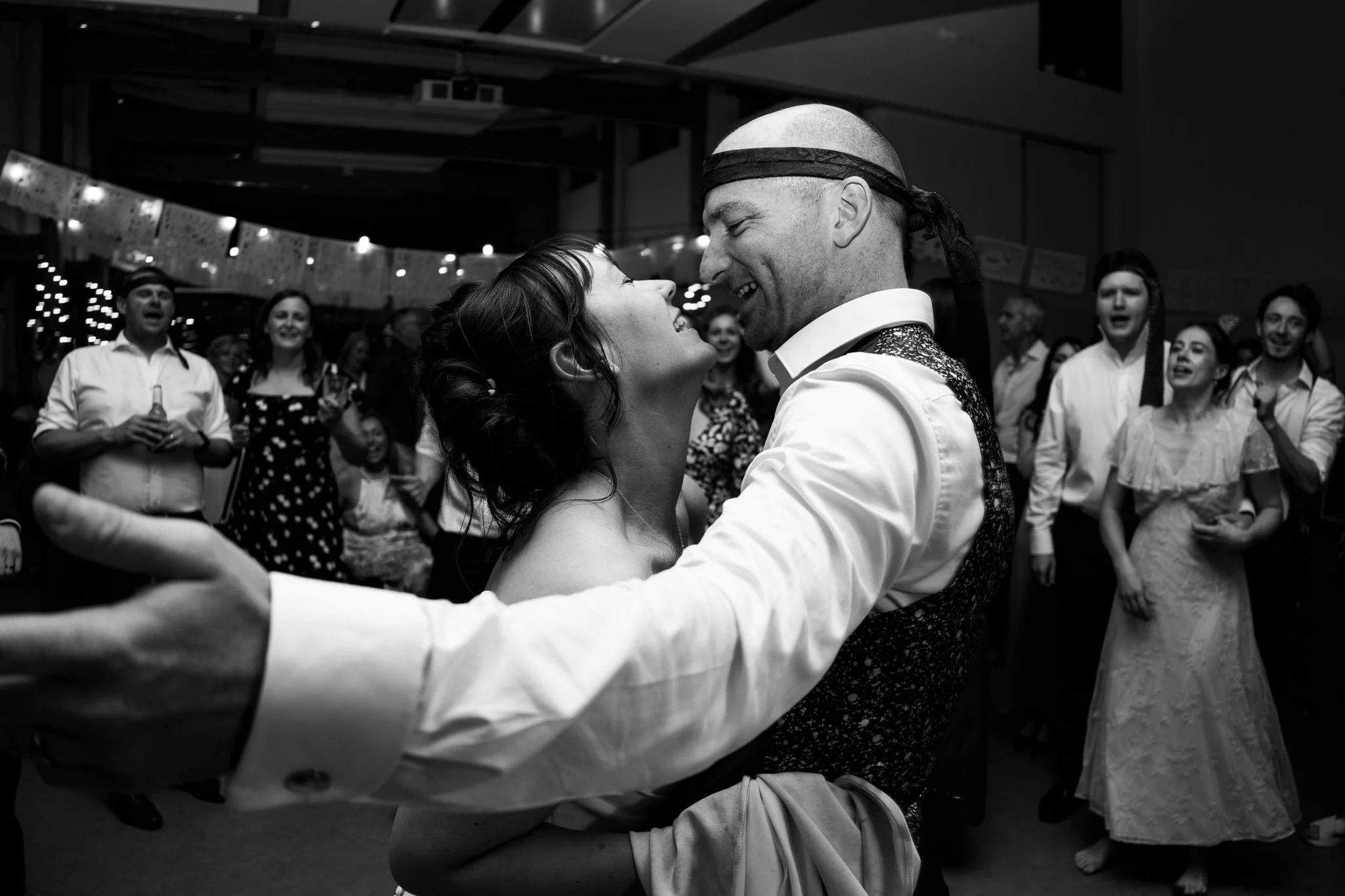 Bride and groom dancing at end of wedding