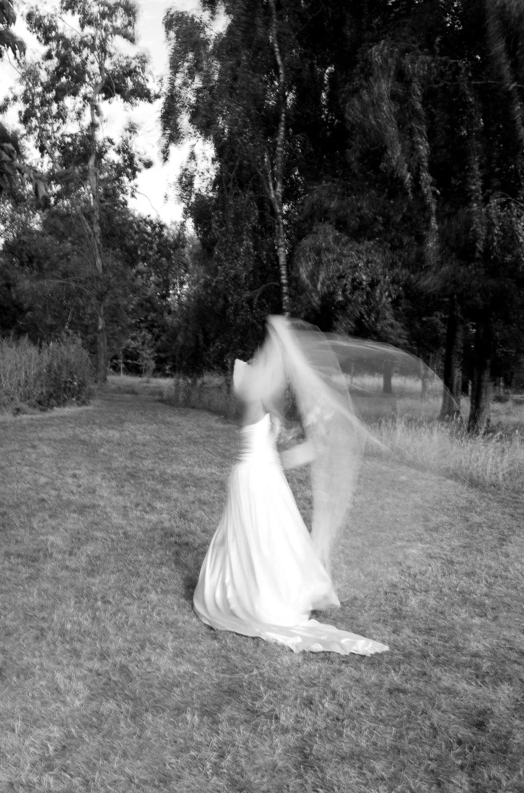 Bride adjusting veil, slow shutter portrait, Matara wedding photographer