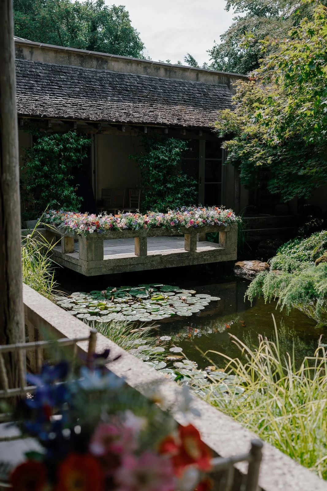 Flowers on ceremony platform, Matara Cotswolds wedding venue