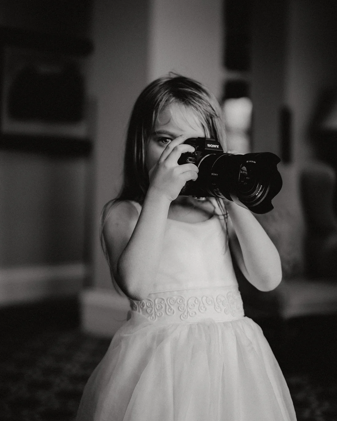 Bristol wedding photography young girl with sony camera at Bowood House