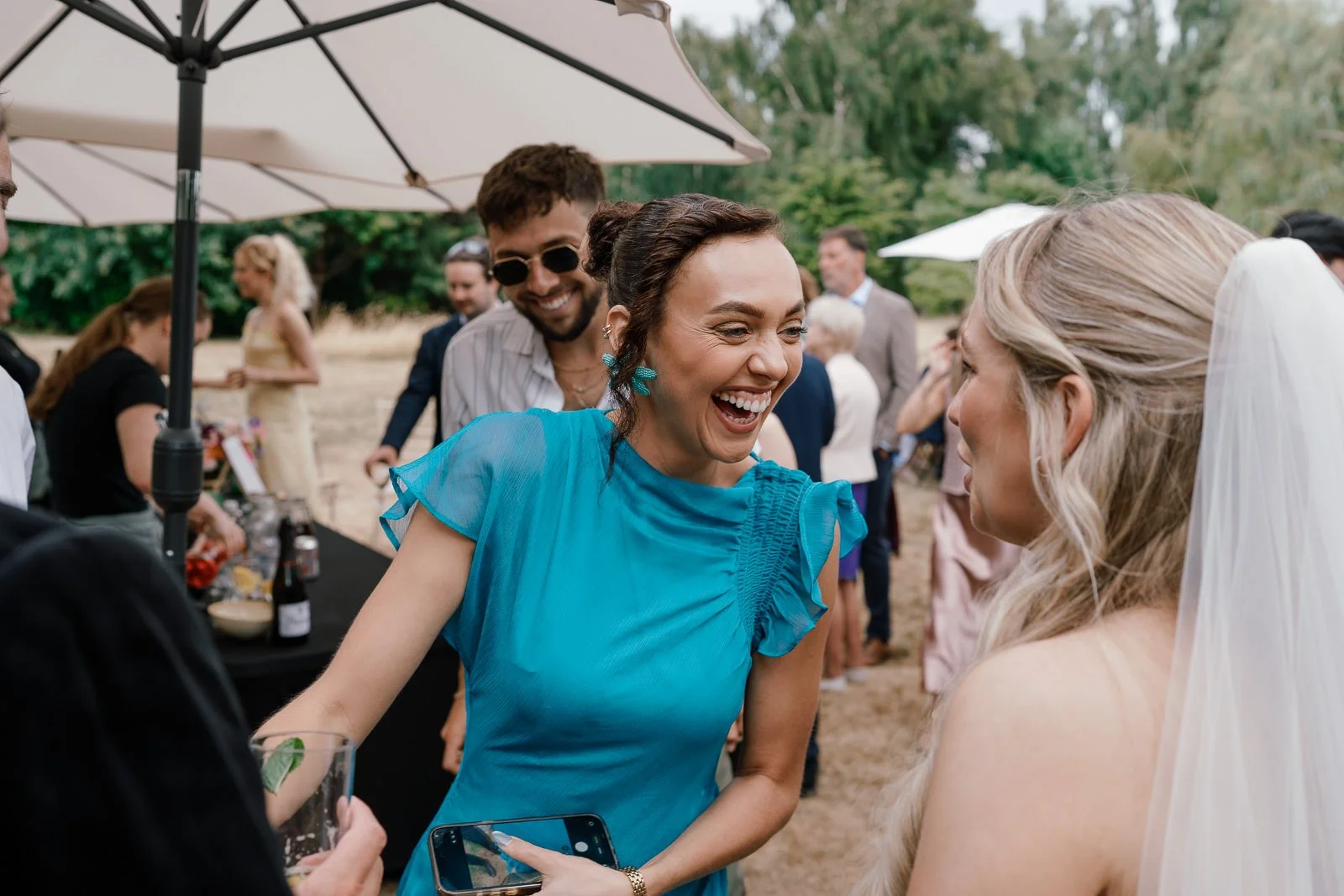 Candid guest laughing at Matara wedding reception