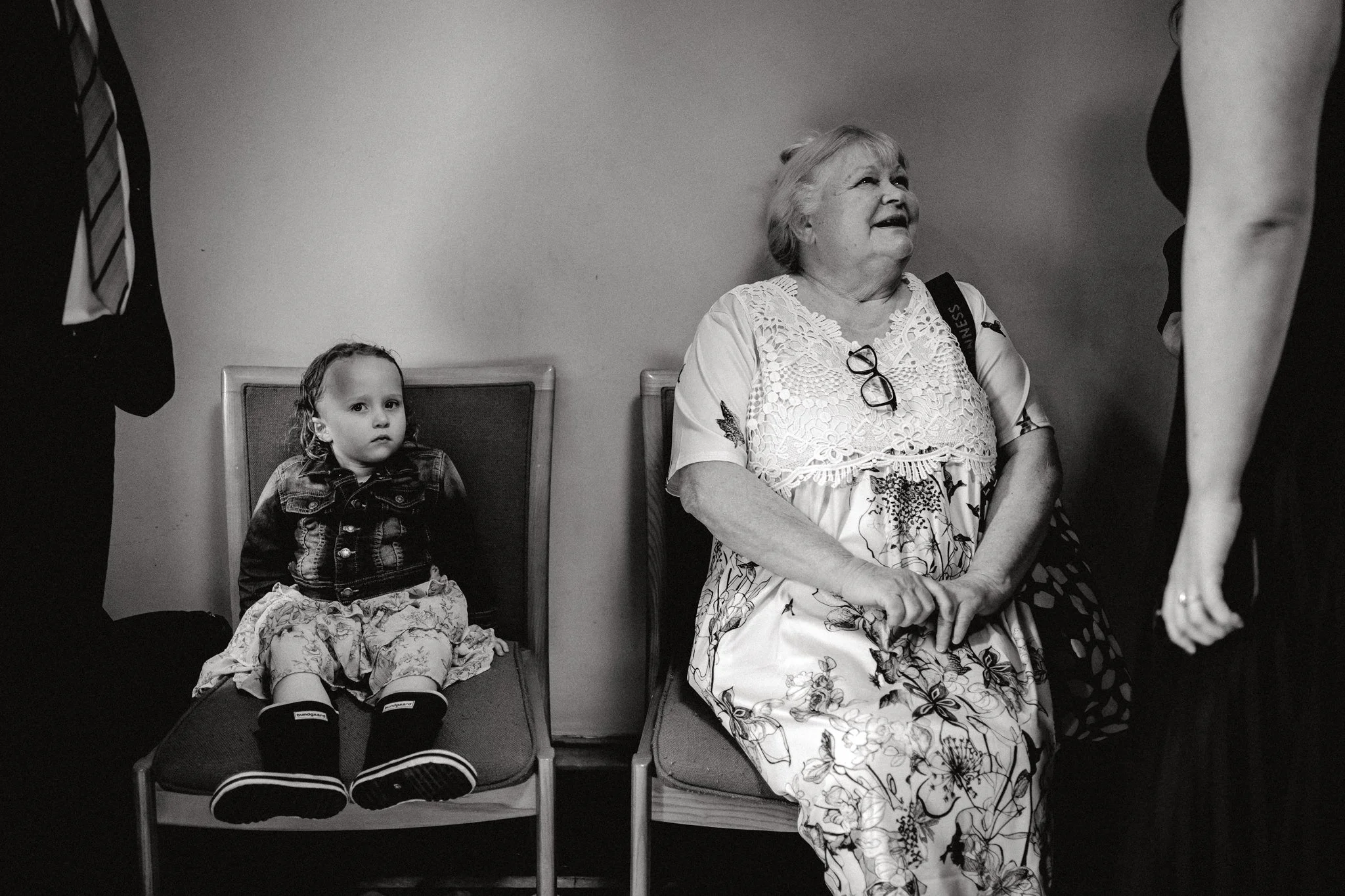 A little girl looks at the camera in Bristol Register Office at a wedding
