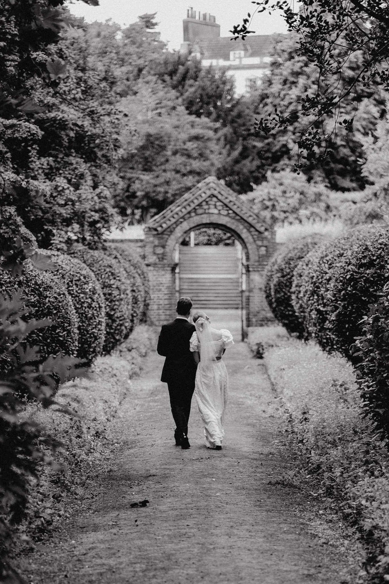 Goldney Hall wedding couple walking in the grounds having a cute moment