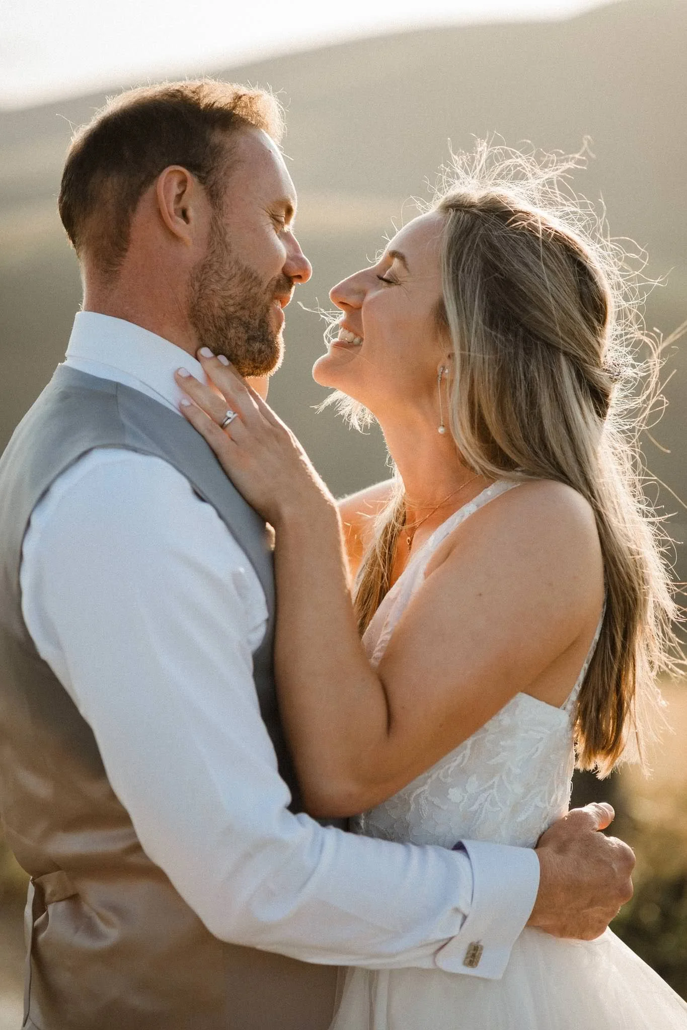 Bride and groom at their wedding at sunset on the hills by Bristol Wedding Photographer