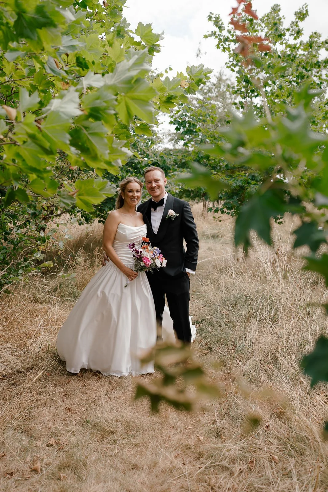 Formal couple portrait on woodland path, Cotswolds wedding photography