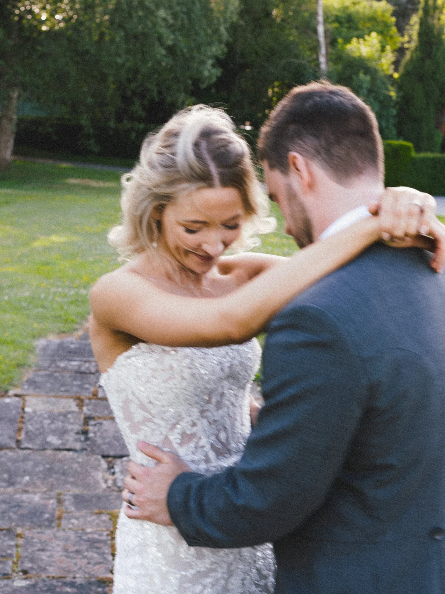 wedding photography of bride and groom dancing outside at Llangoed Hall