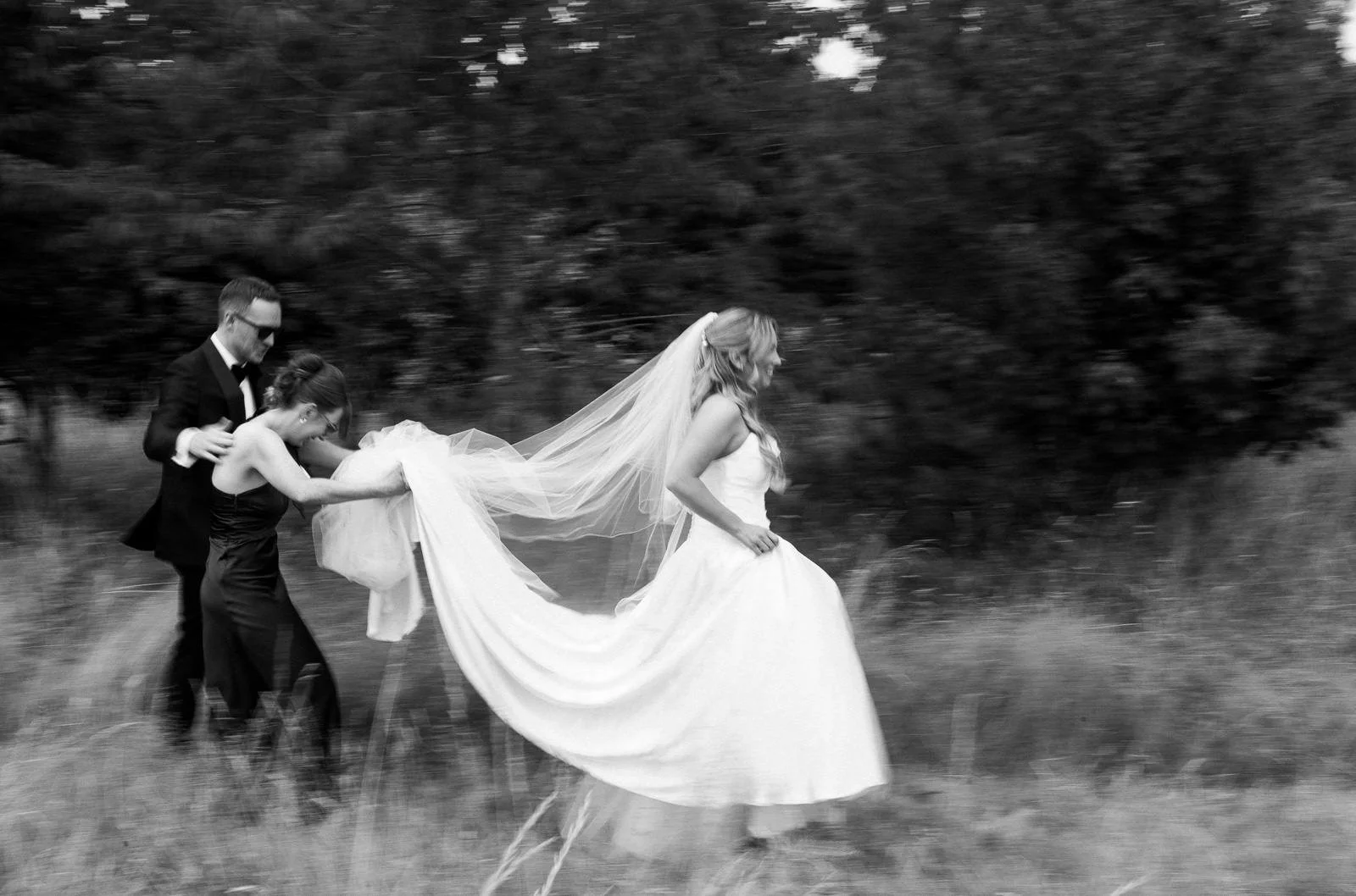 Bride and groom walking through the grounds with bridesmaid, Matara wedding photography