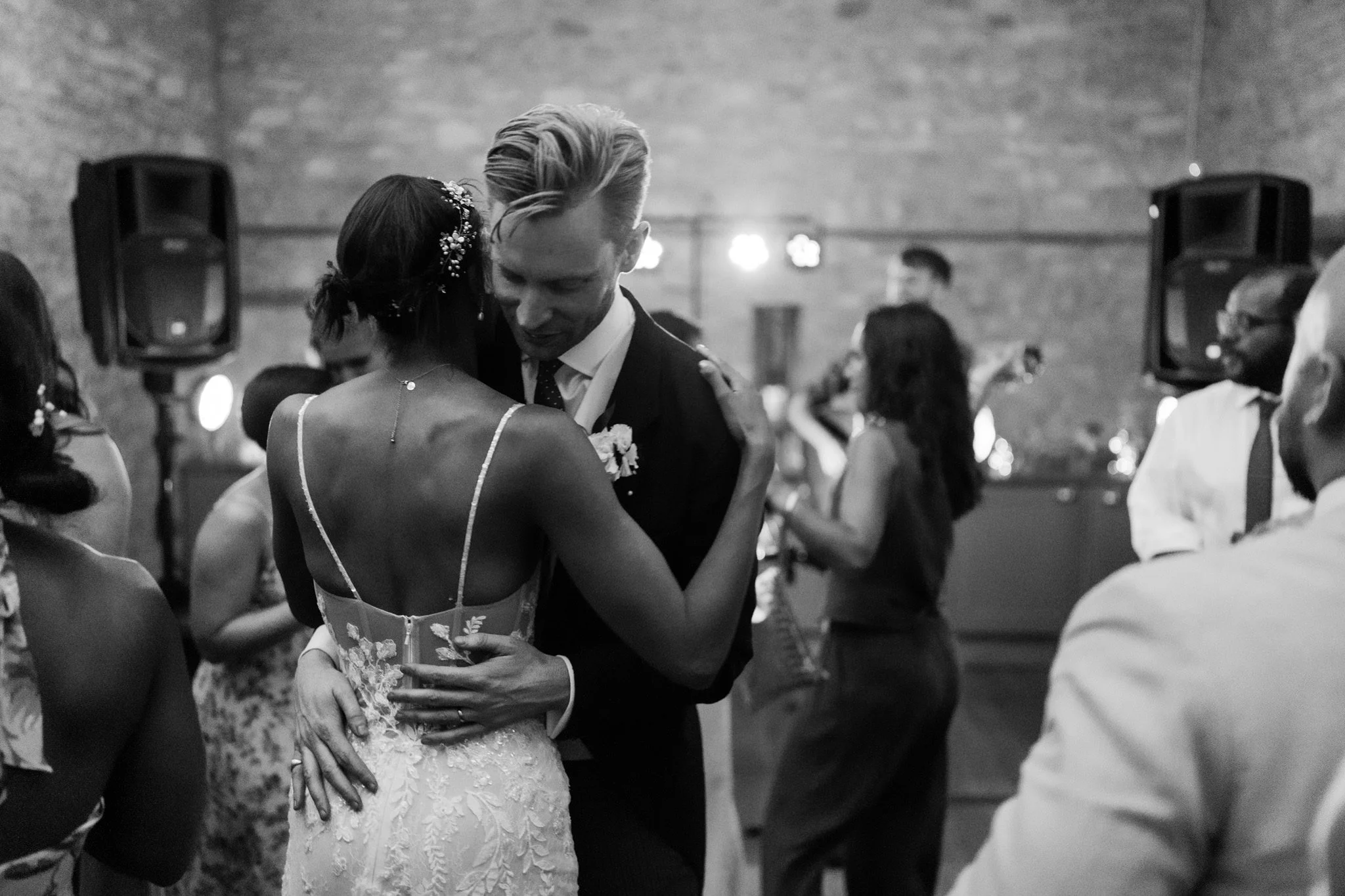 Bride and groom dancing in black and white
