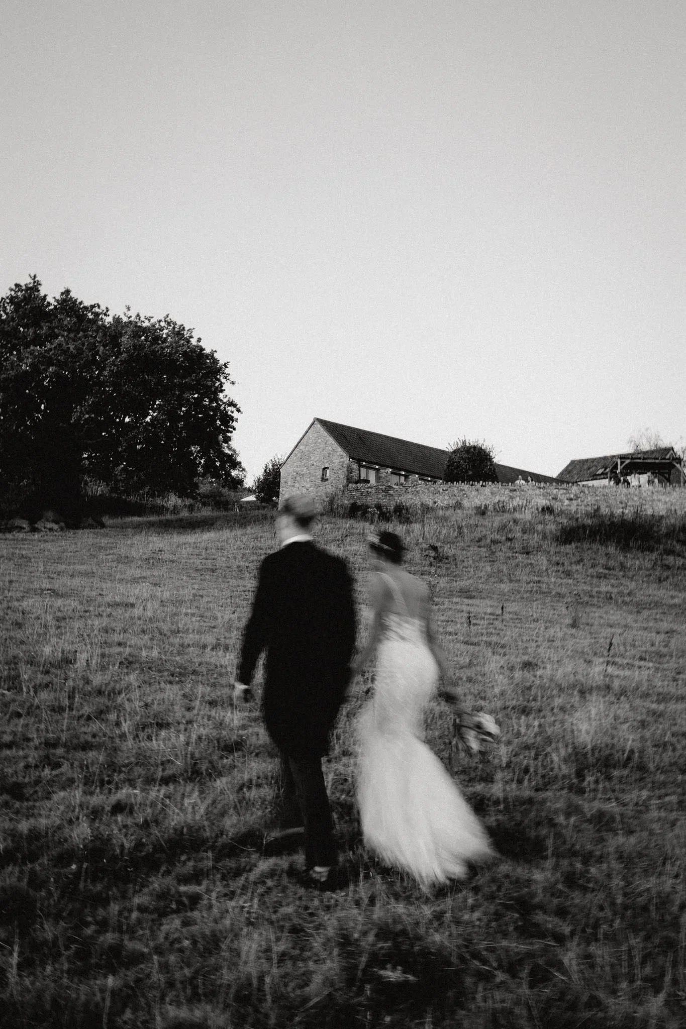 Slow shutter black and white photograph of bride and groom at their wedding in Bristol
