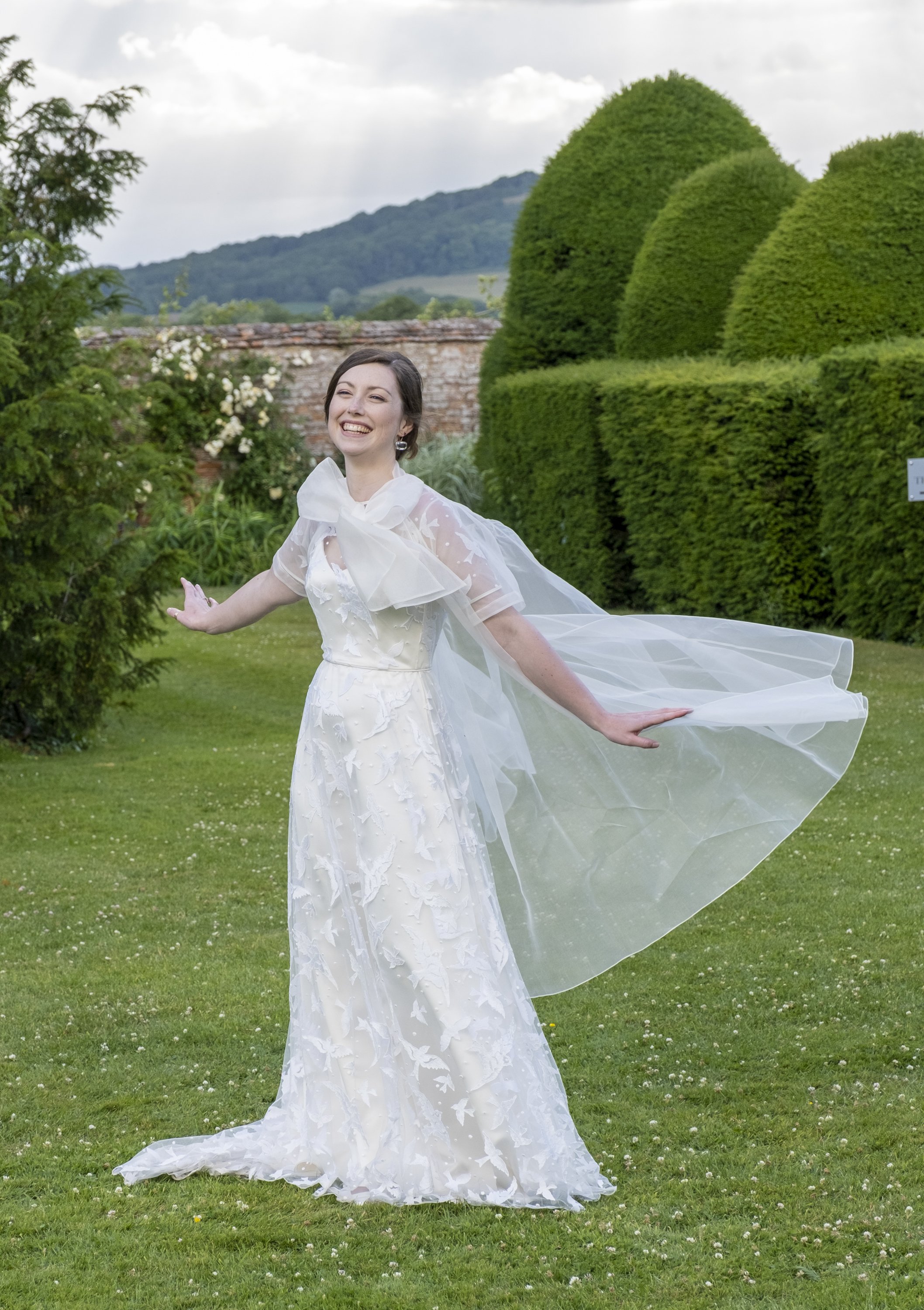 Beautiful bride Harriet wore the Bluebell wedding dress and Long Organza Bow Jacket by Halfpenny London