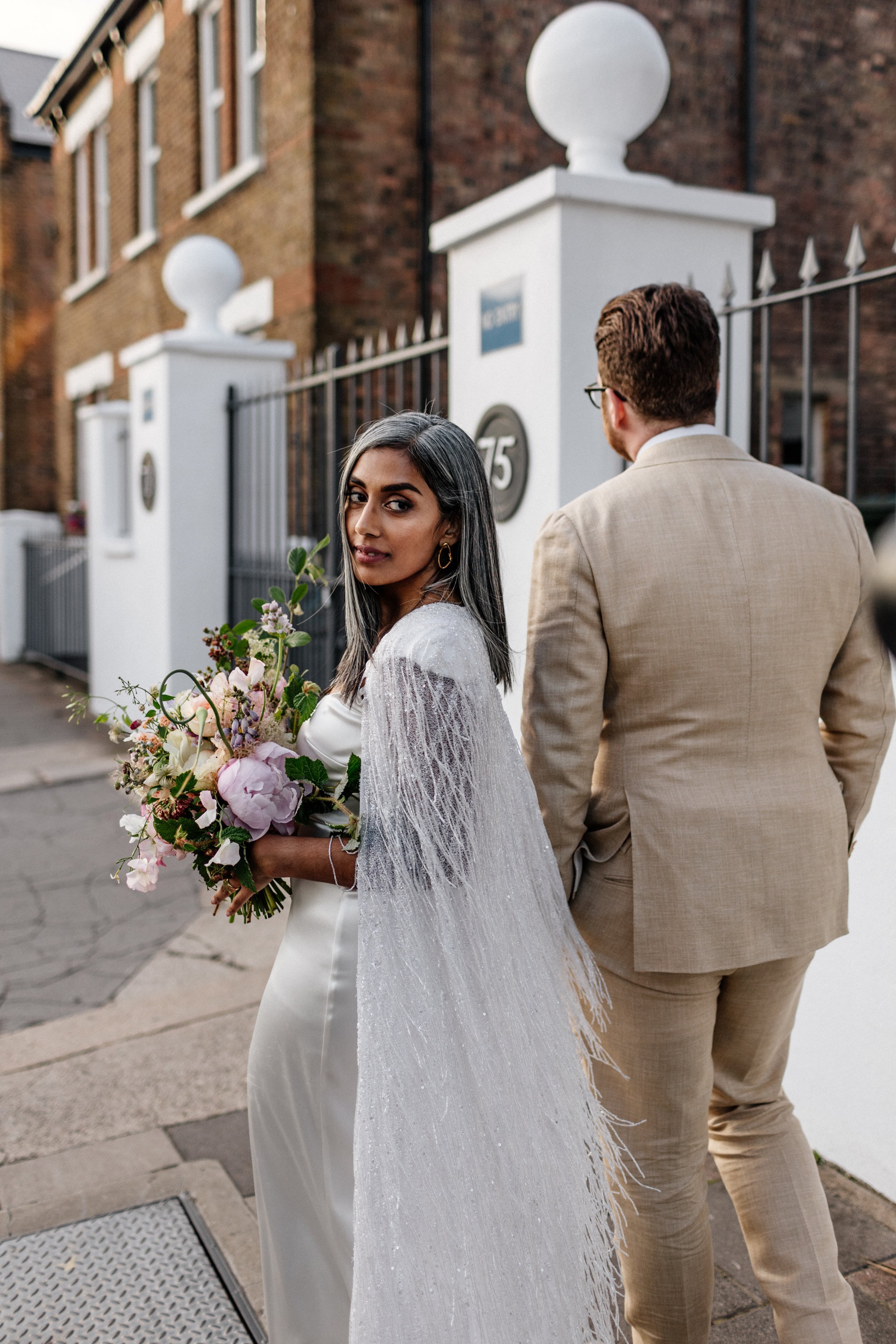 Beautiful bride Rebecca wore a wedding dress and beaded cape by Halfpenny London