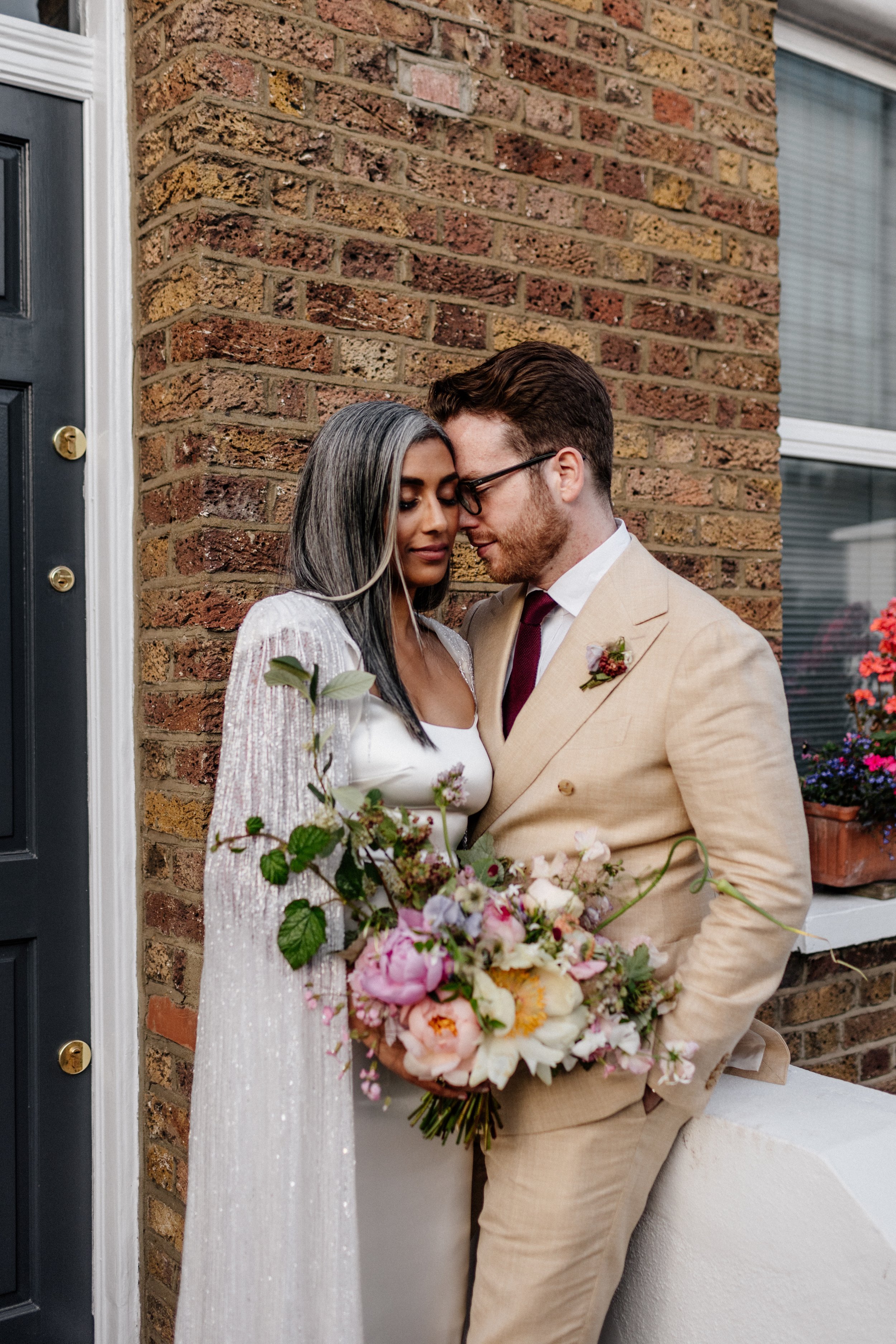 Beautiful bride Rebecca wore a wedding dress and beaded cape by Halfpenny London