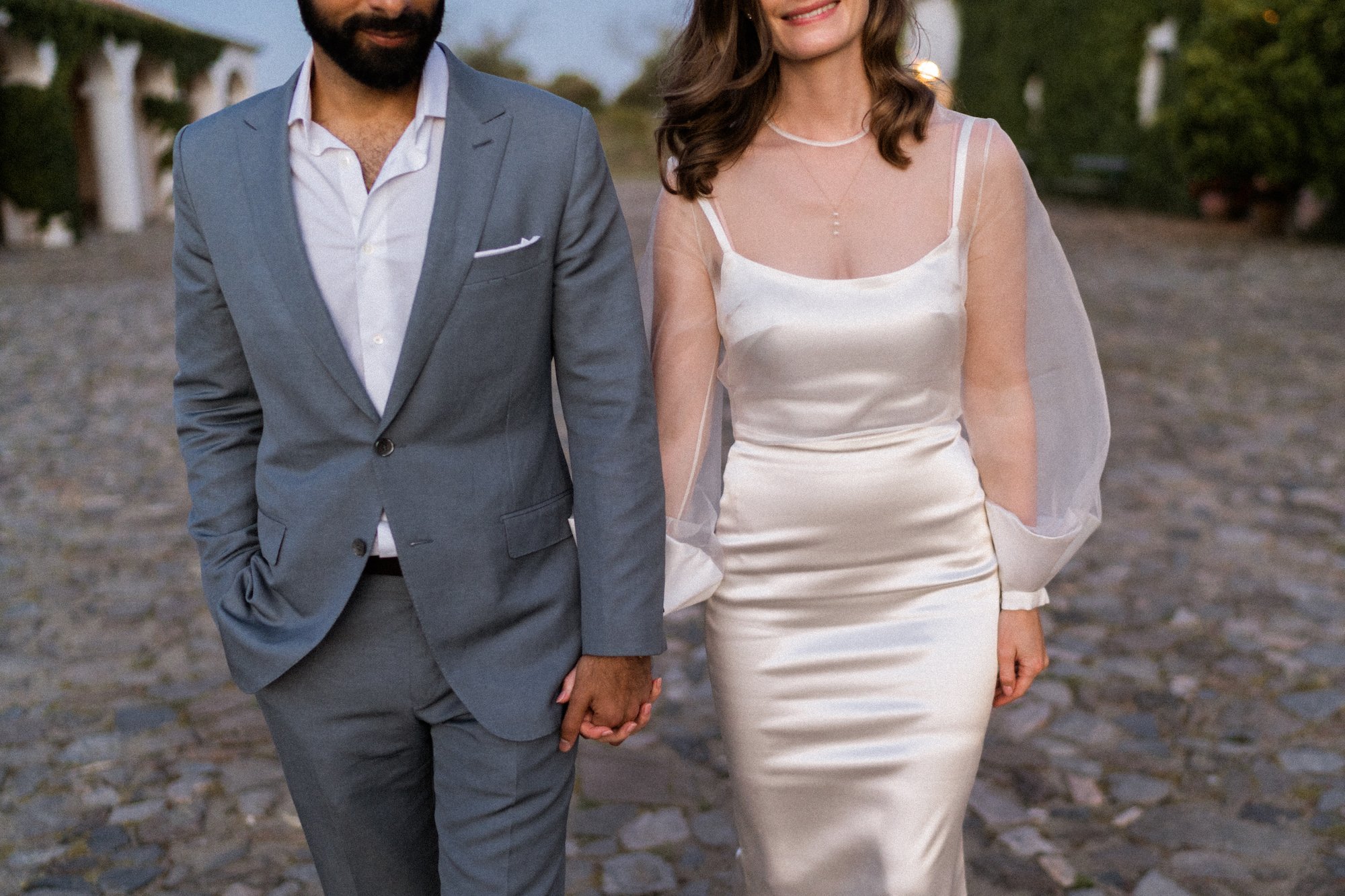 Beautiful bride Genevieve wore a wedding dress and a sheer top with statement sleeves by Halfpenny London