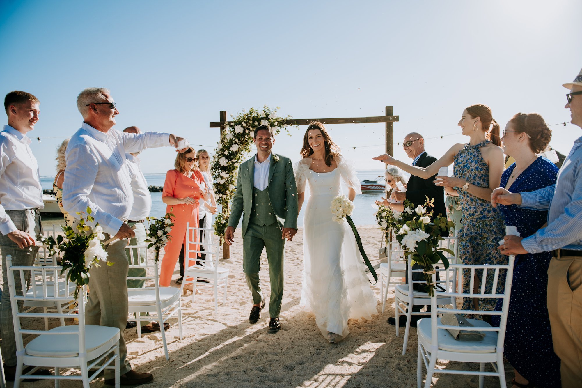 Beautiful Charlotte wore the silk organza Mayfair wedding dress by Halfpenny London for her beach destination wedding