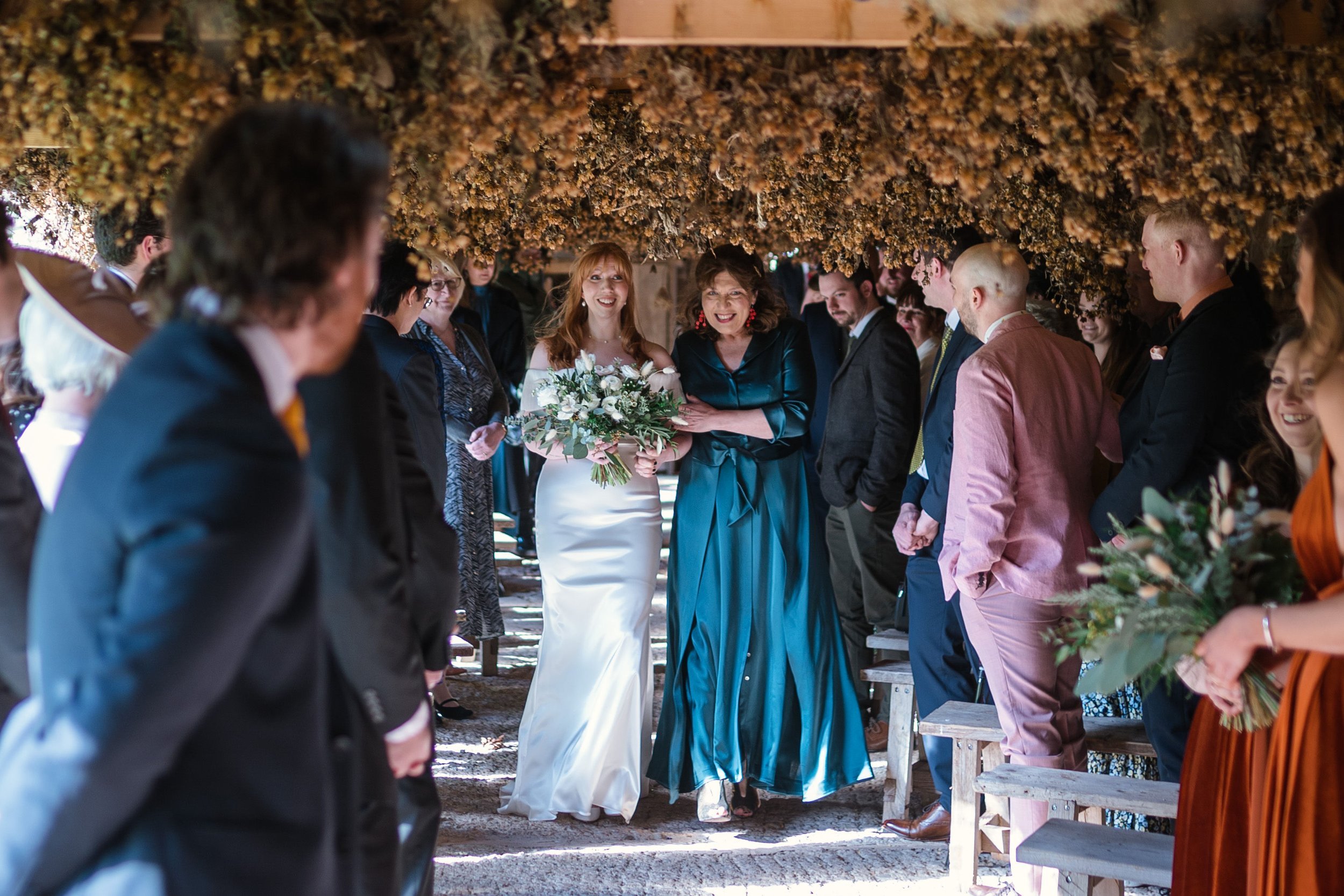 Beautiful bride Ellen wears the Harbour frill dress by British bridal designer Halfpenny London