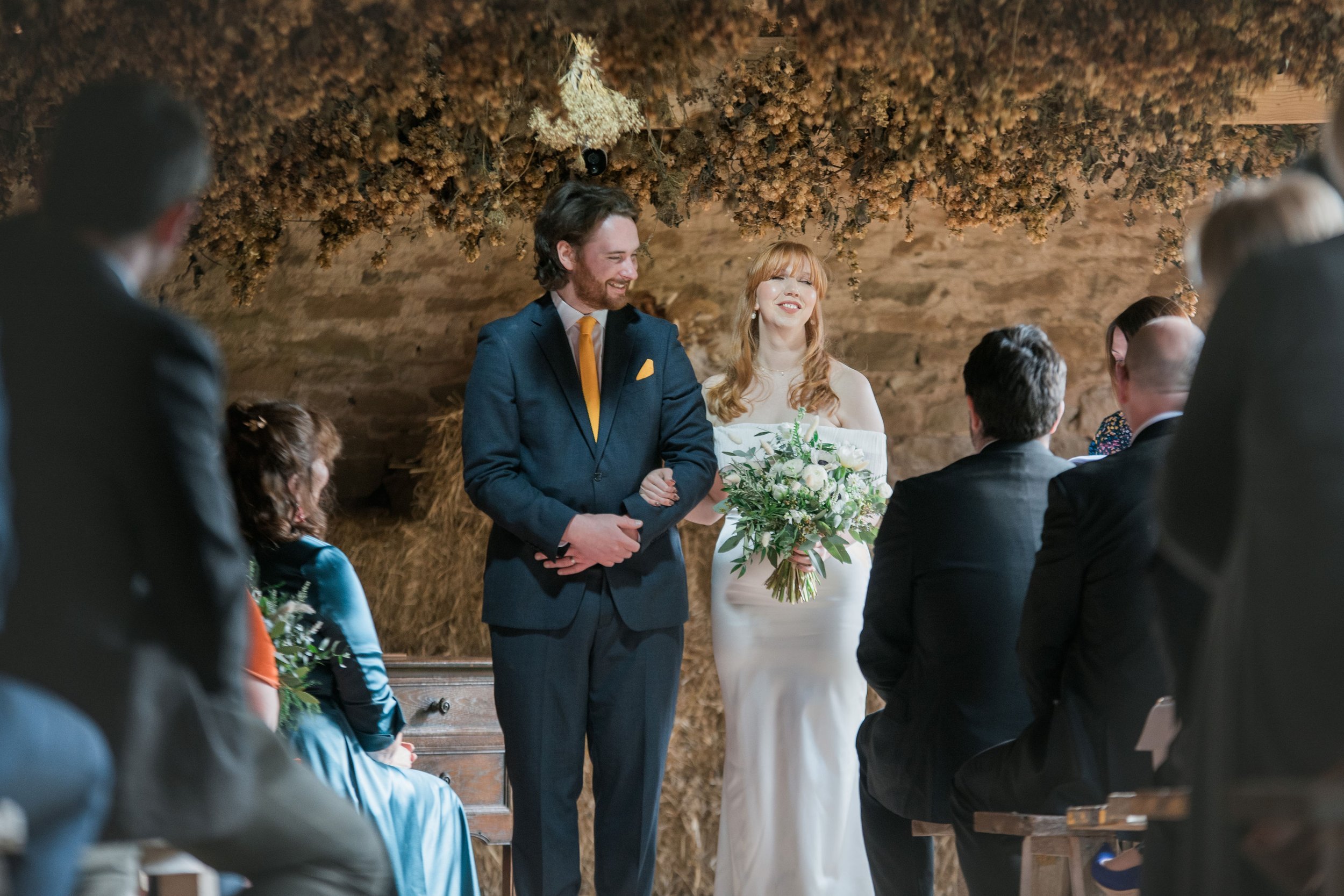 Beautiful bride Ellen wears the Harbour frill dress by British bridal designer Halfpenny London