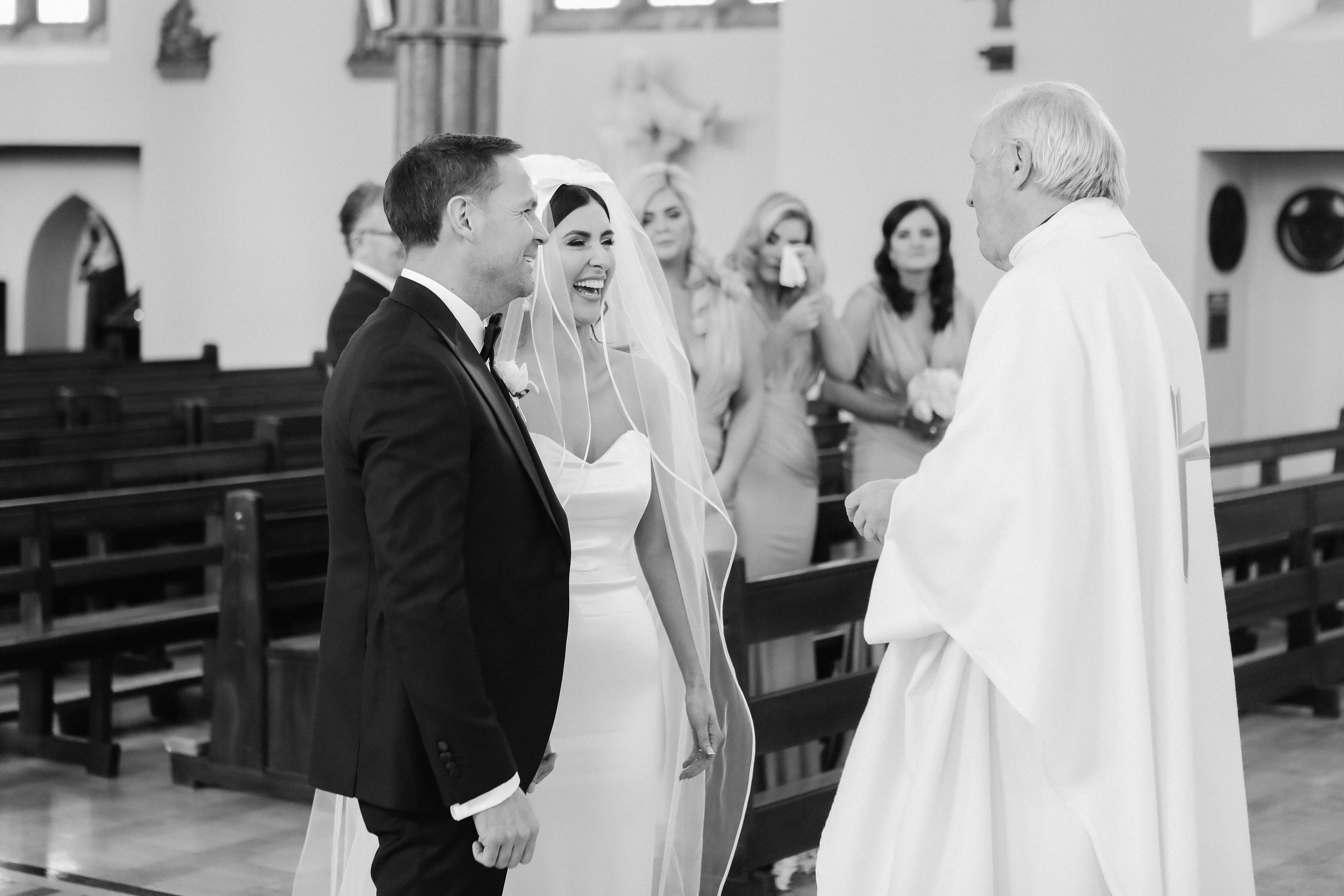 Beautiful bride Ciara wears the Dayton dress and Ariel bow by Halfpenny London