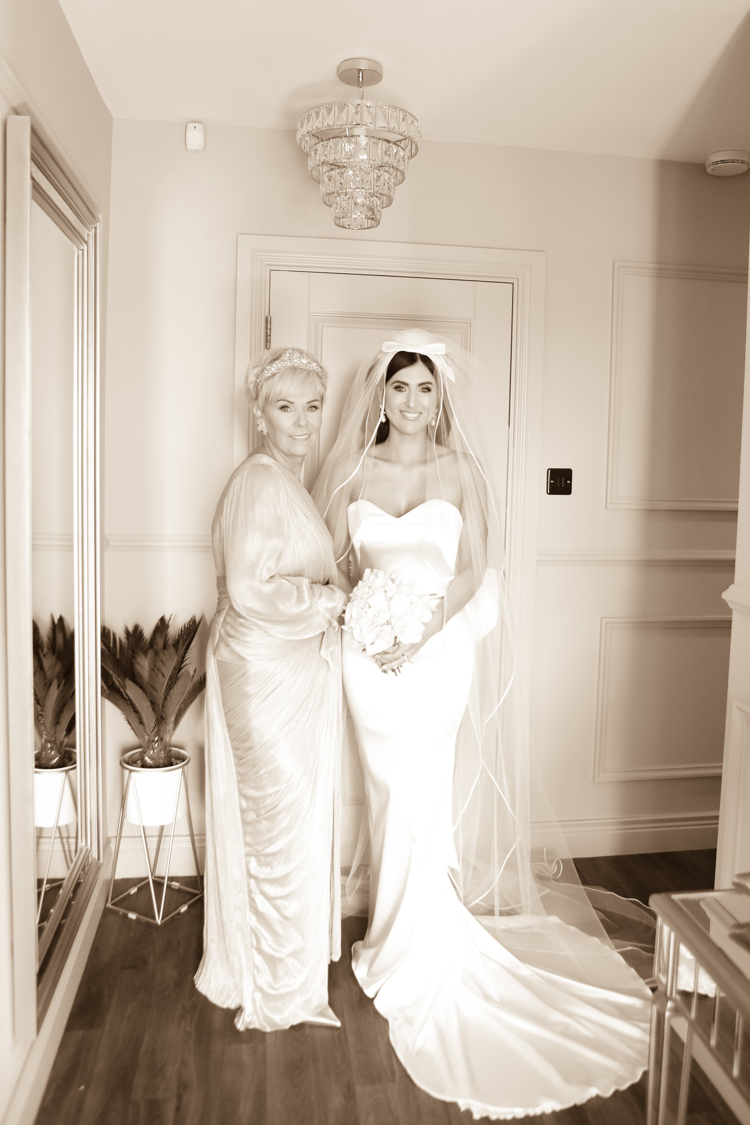 Beautiful bride Ciara wears the Dayton dress and Ariel bow by Halfpenny London