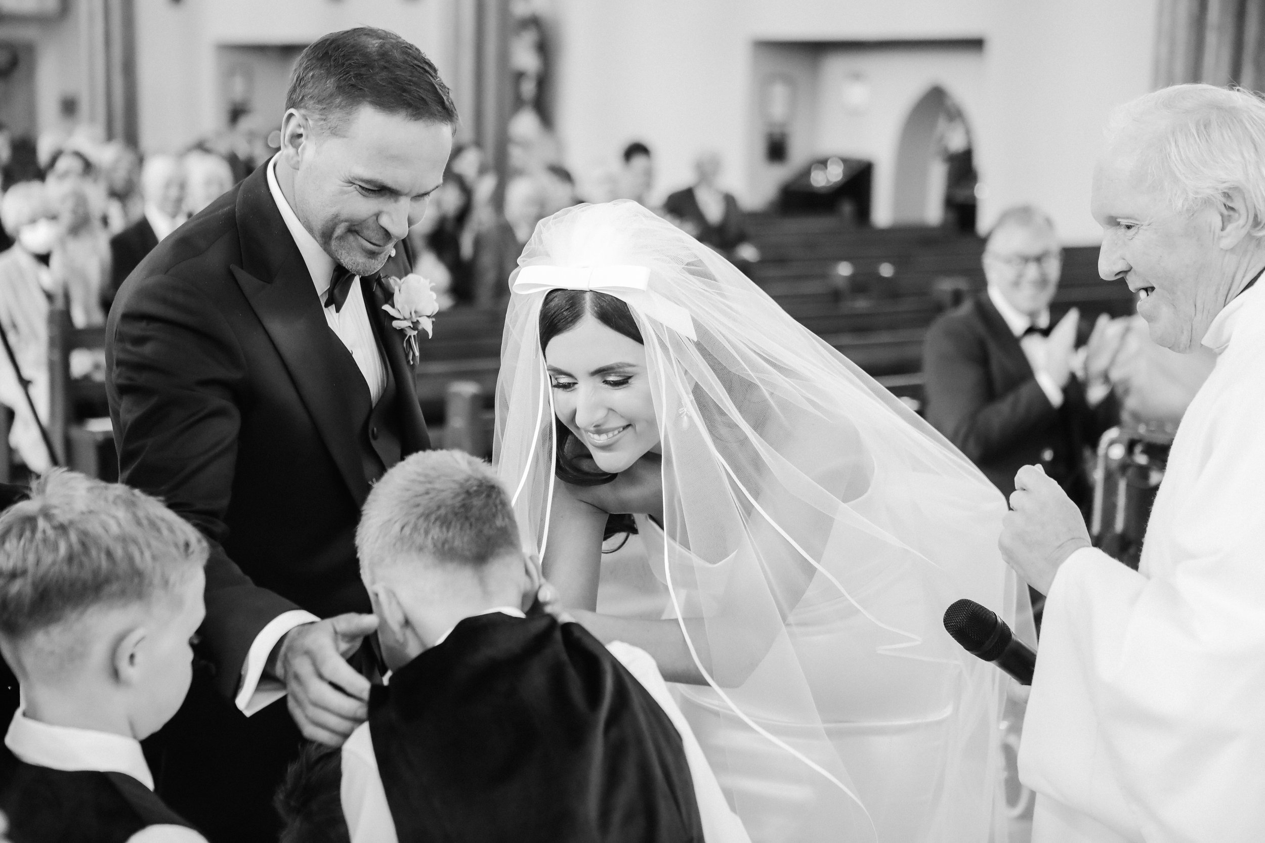 Beautiful bride Ciara wears the Dayton dress and Ariel bow by Halfpenny London