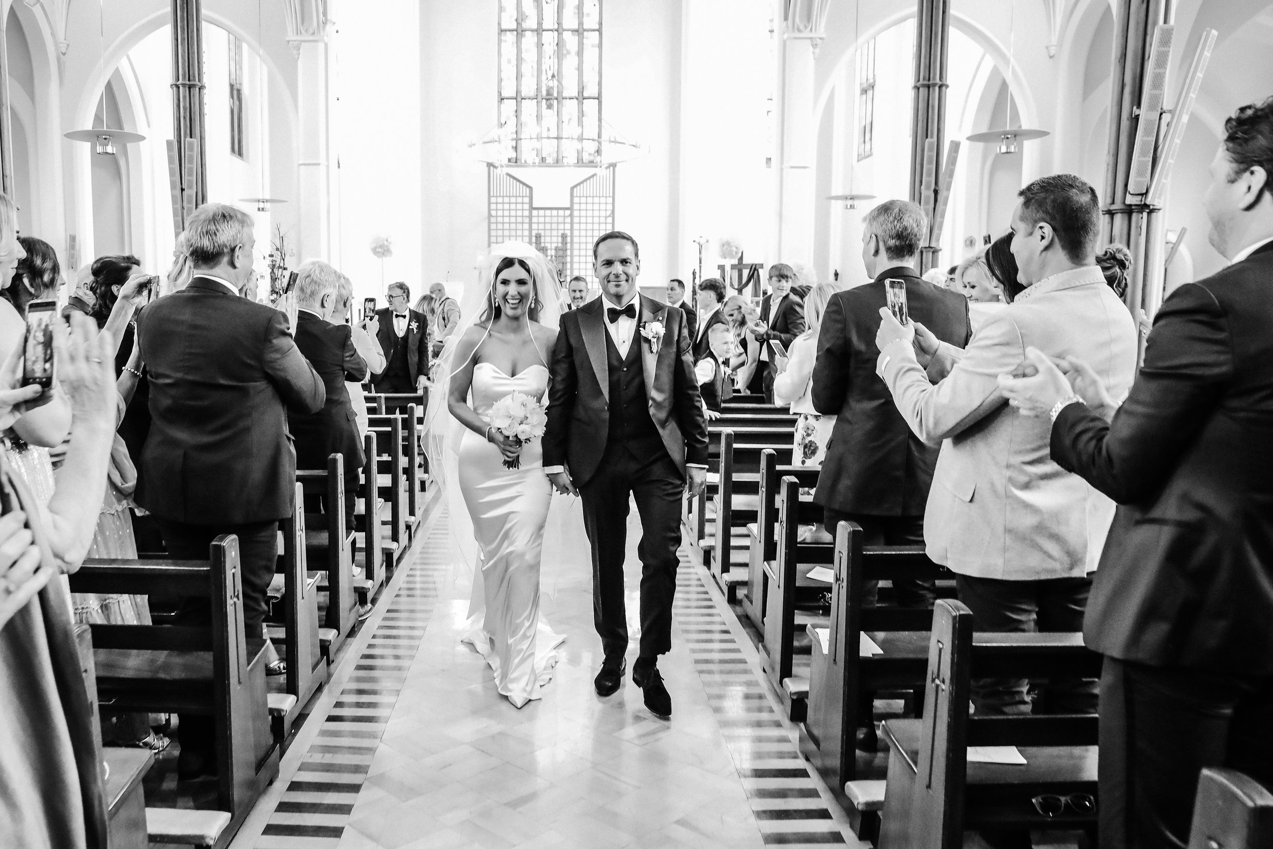 Beautiful bride Ciara wears the Dayton dress and Ariel bow by Halfpenny London