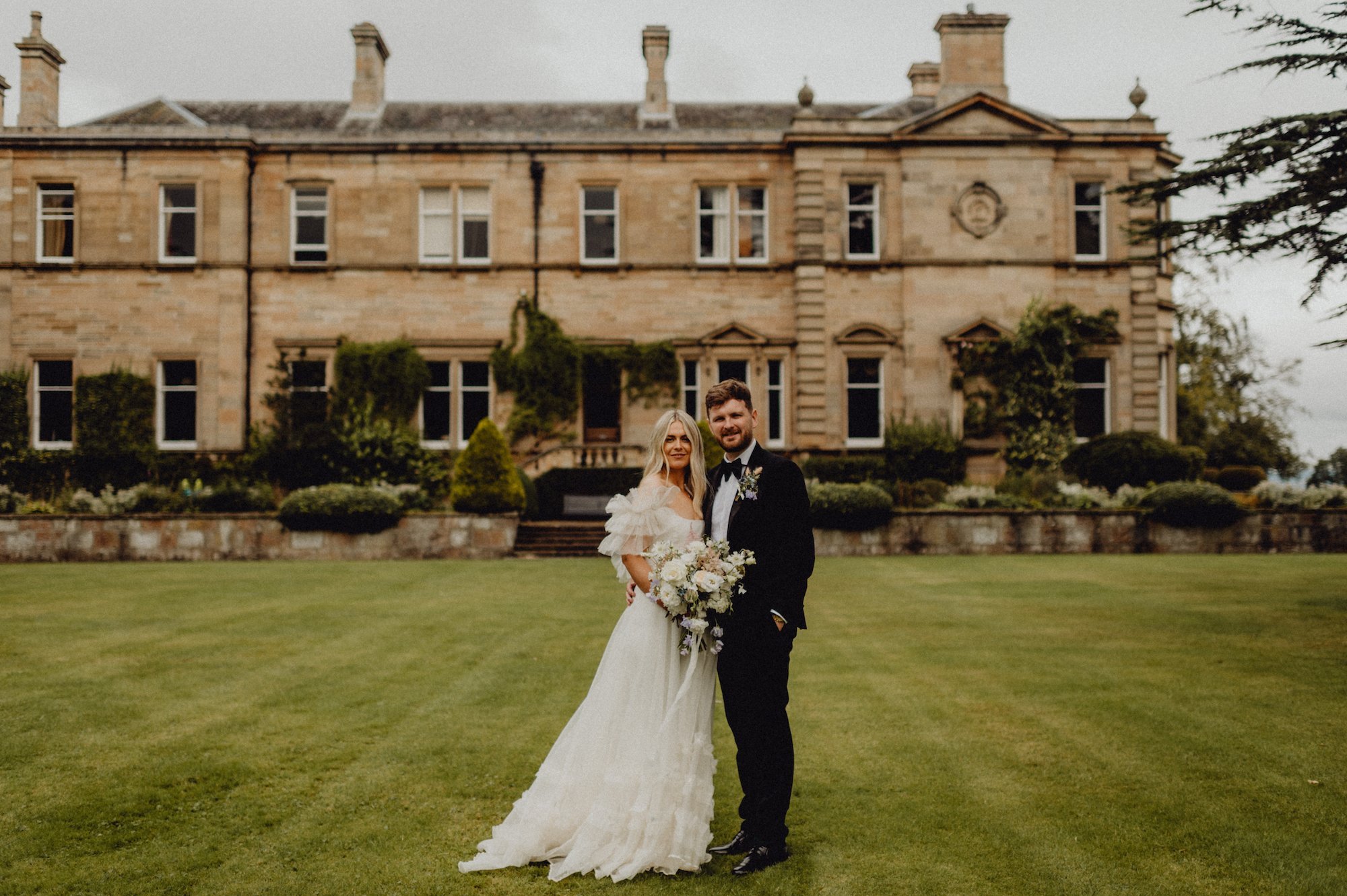 Beautiful bride April wears the Mayfair dress by Halfpenny London