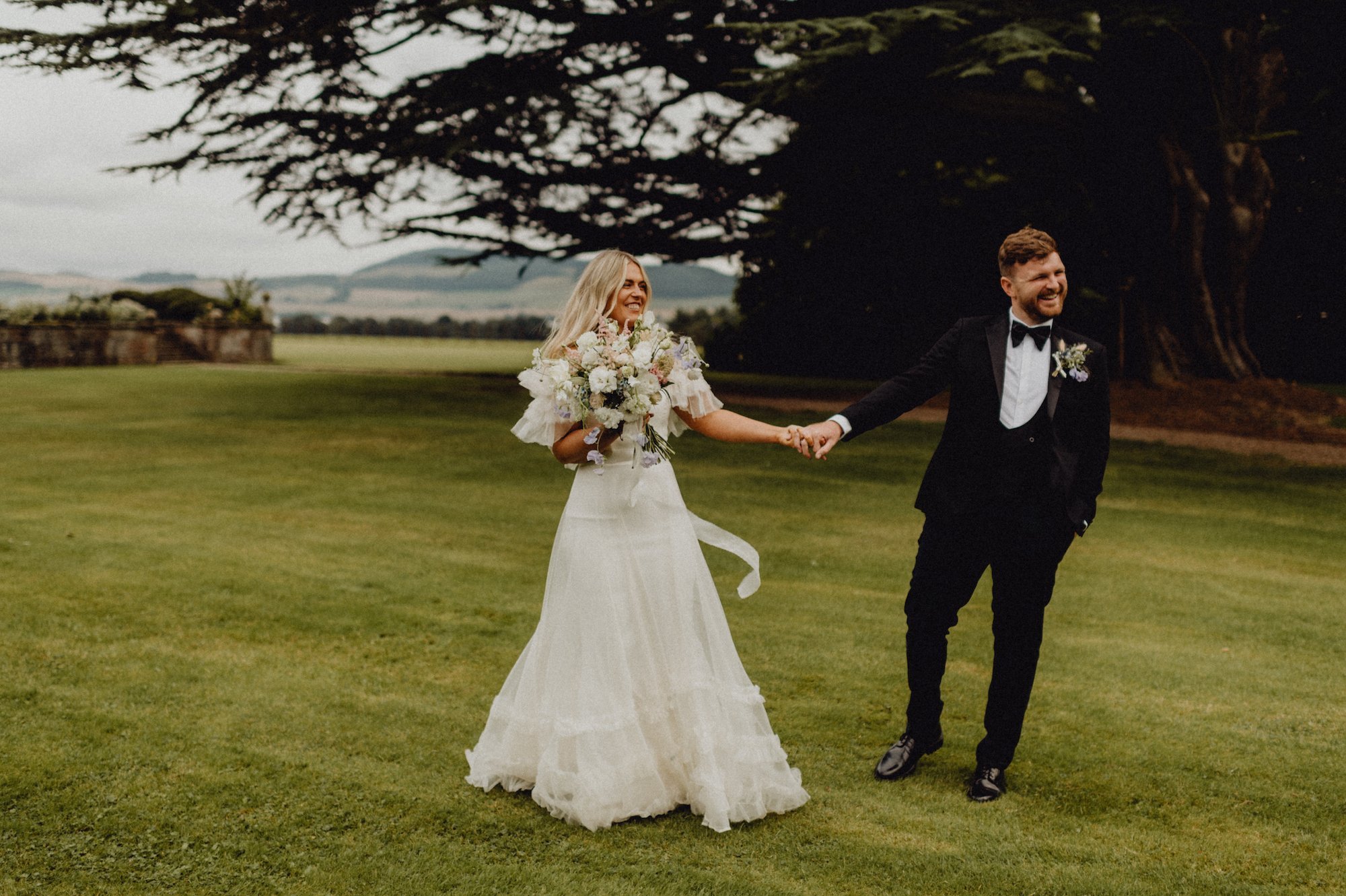 Beautiful bride April wears the Mayfair dress by Halfpenny London