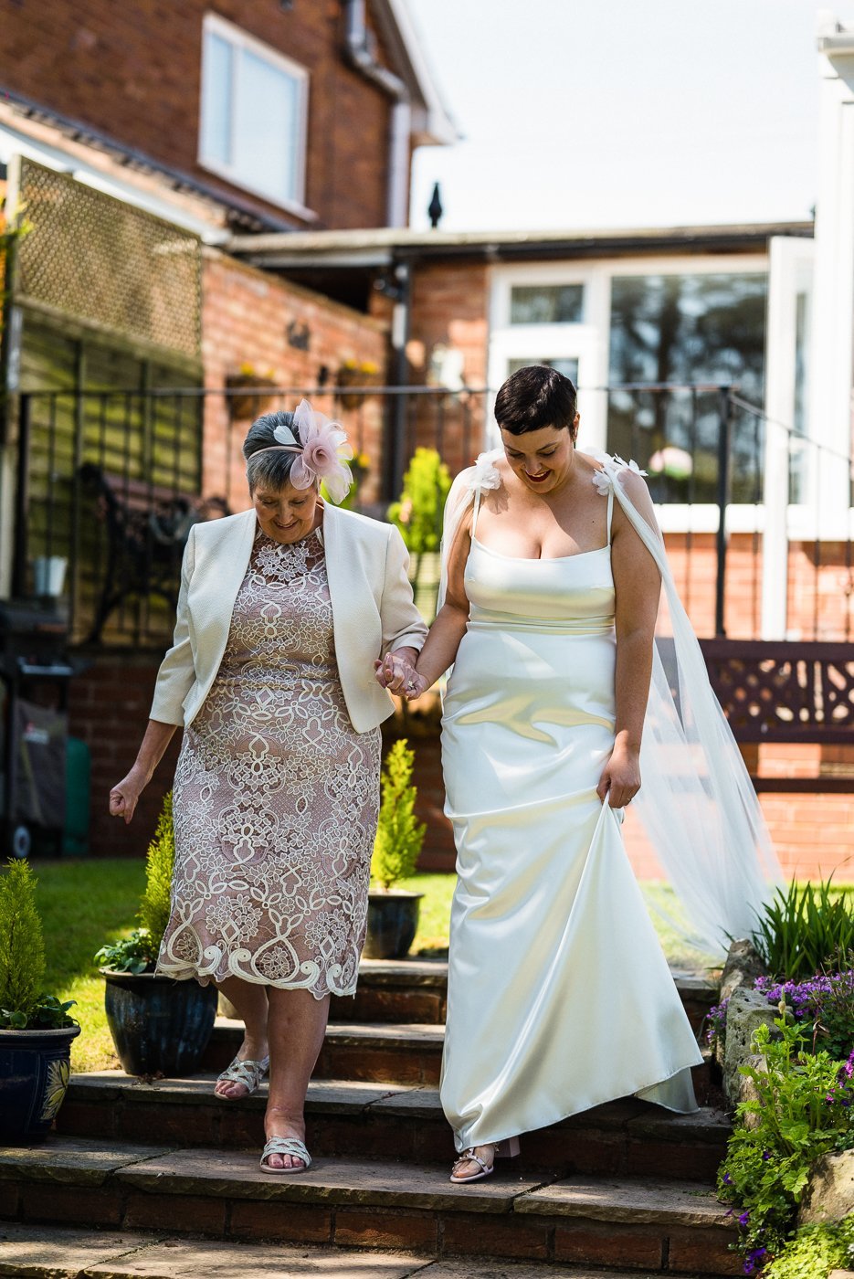 Beautiful bride Emily wore the Dion wedding dress and Campagne cape by Halfpenny London