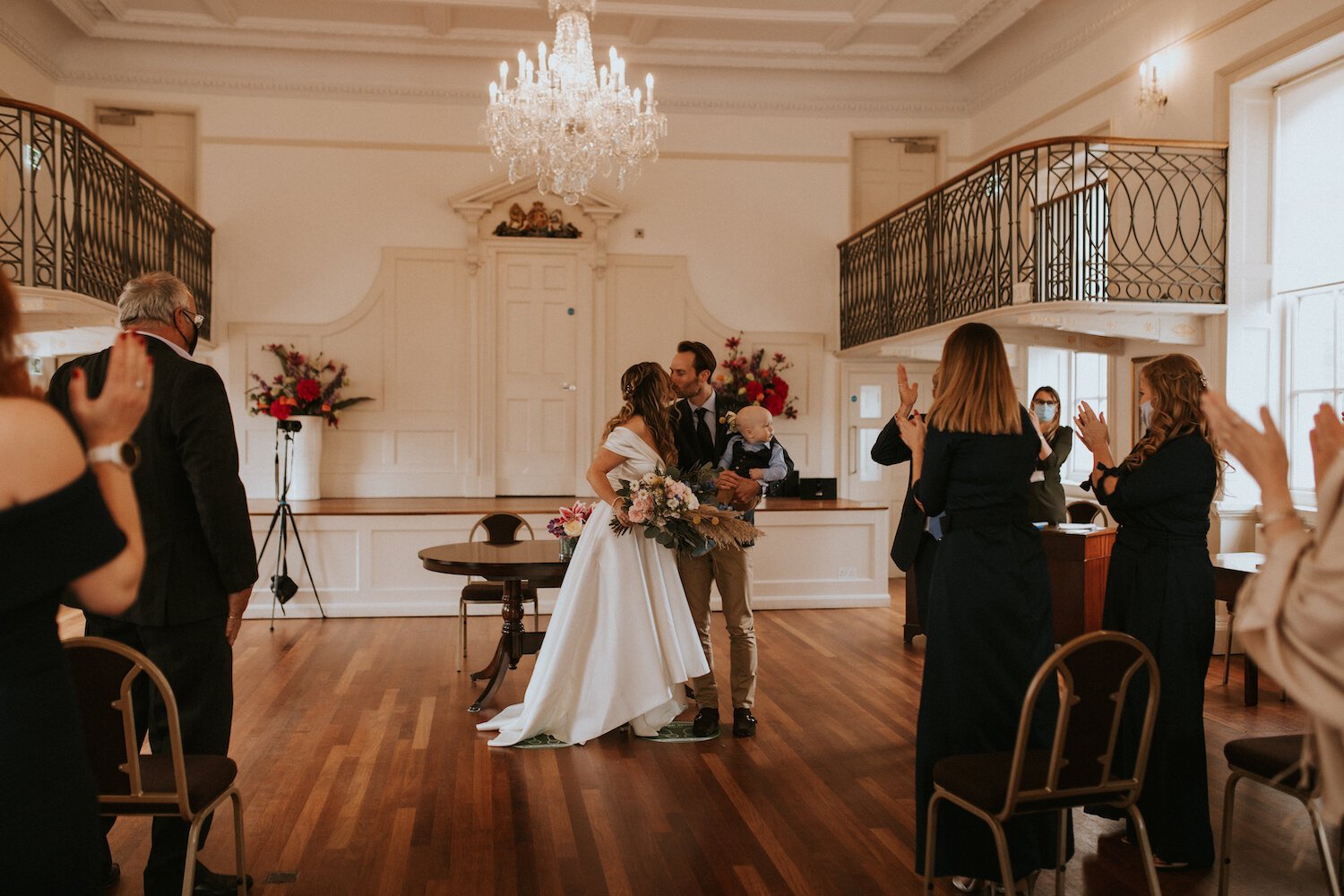 Beautiful bride Gina wore an off the shoulder top and High-Low skirt - bridal separates by Halfpenny London - with white ankle boots on her wedding day