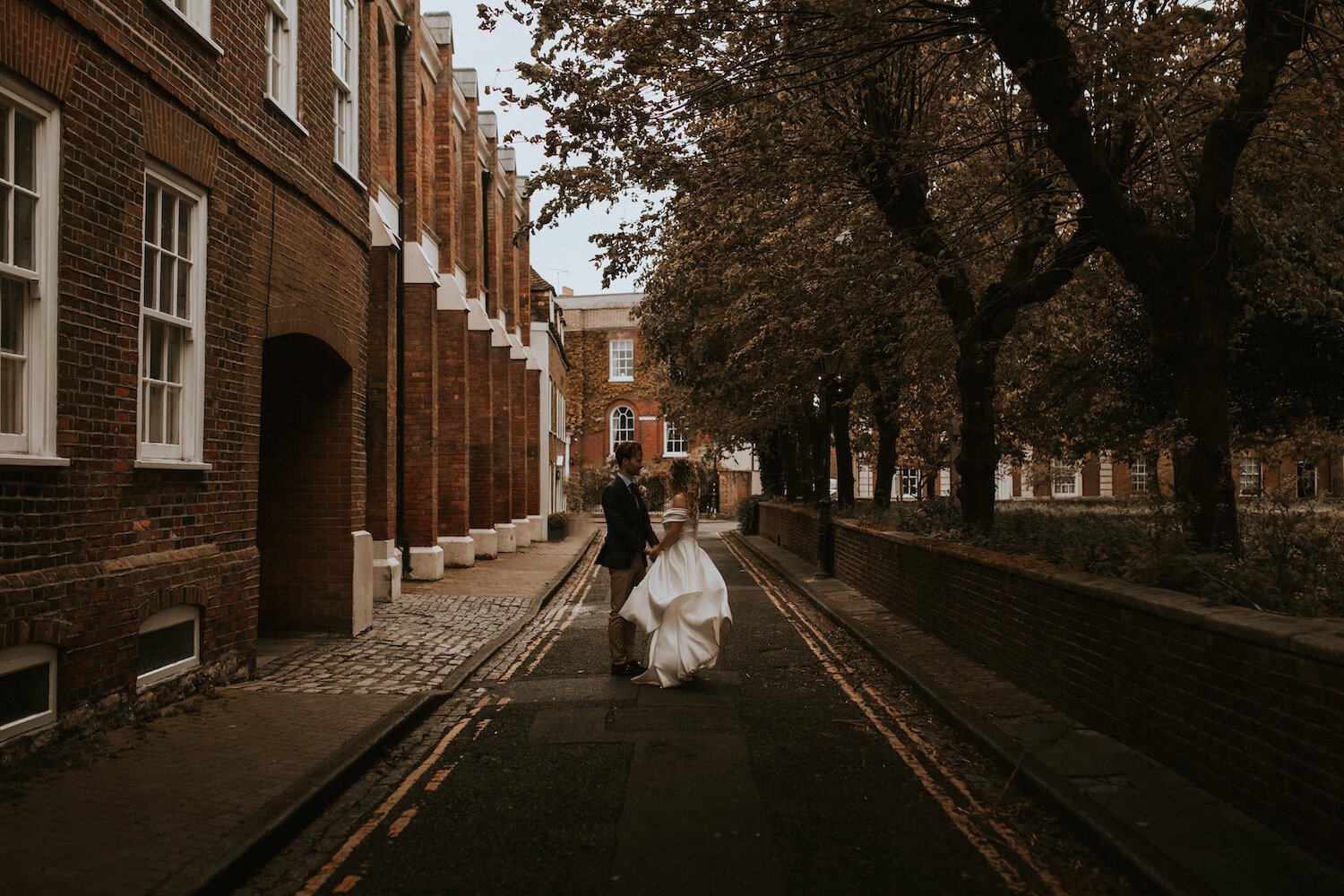 Beautiful bride Gina wore an off the shoulder top and High-Low skirt - bridal separates by Halfpenny London - with white ankle boots on her wedding day