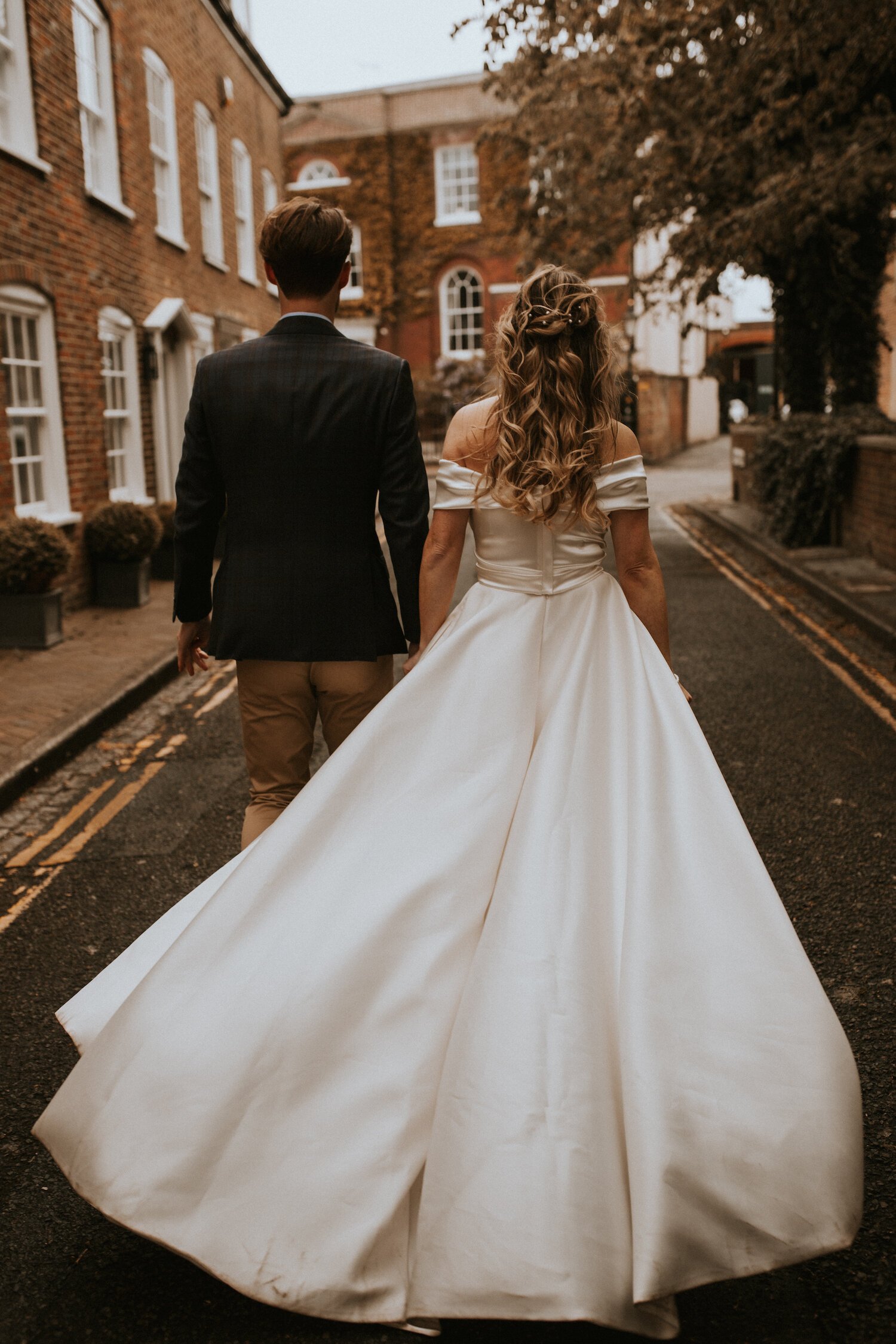 Beautiful bride Gina wore an off the shoulder top and High-Low skirt - bridal separates by Halfpenny London - with white ankle boots on her wedding day