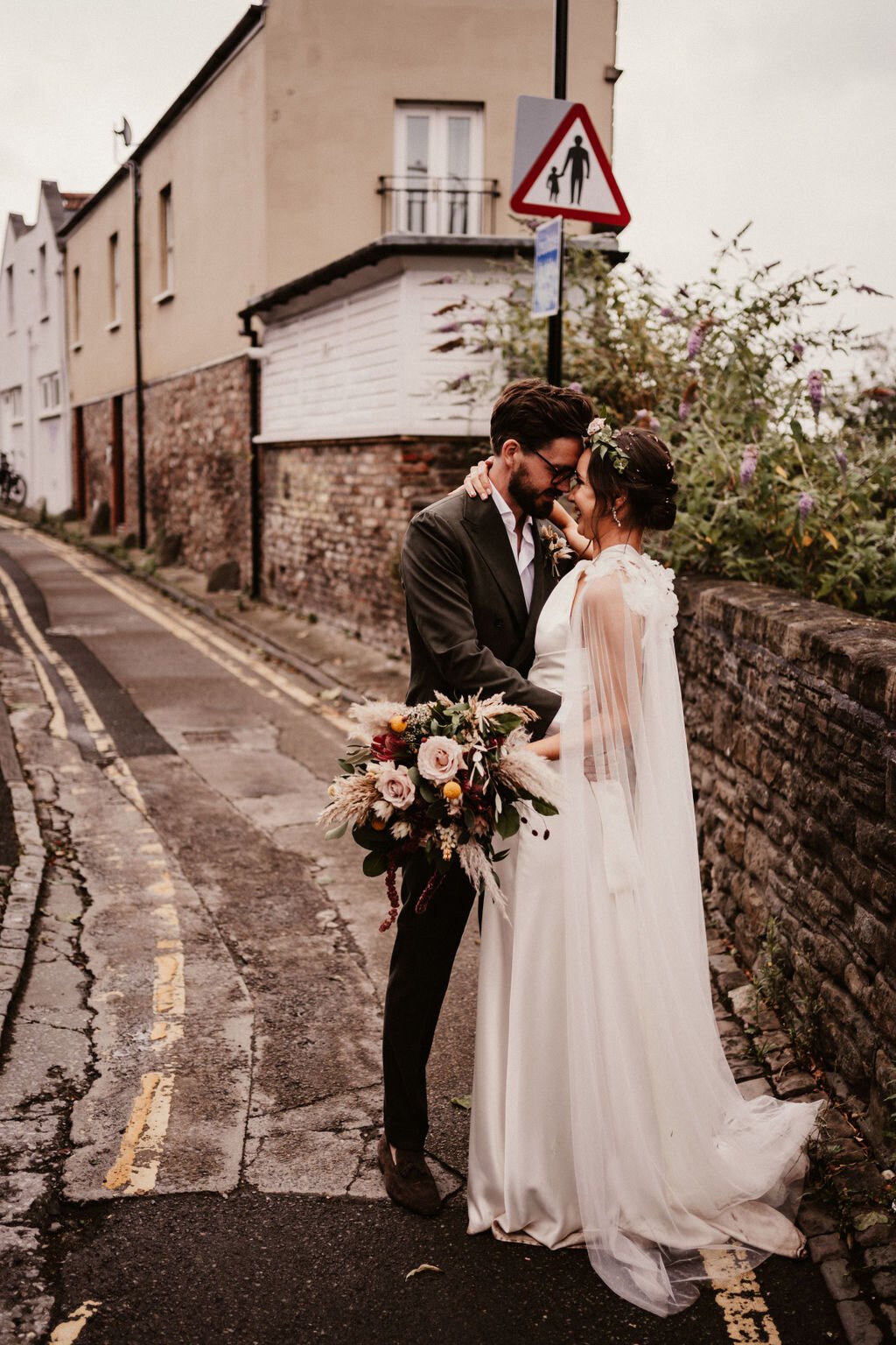 Beautiful bride Rach wore the Cheryl wedding dress and Campagne cape by Halfpenny London