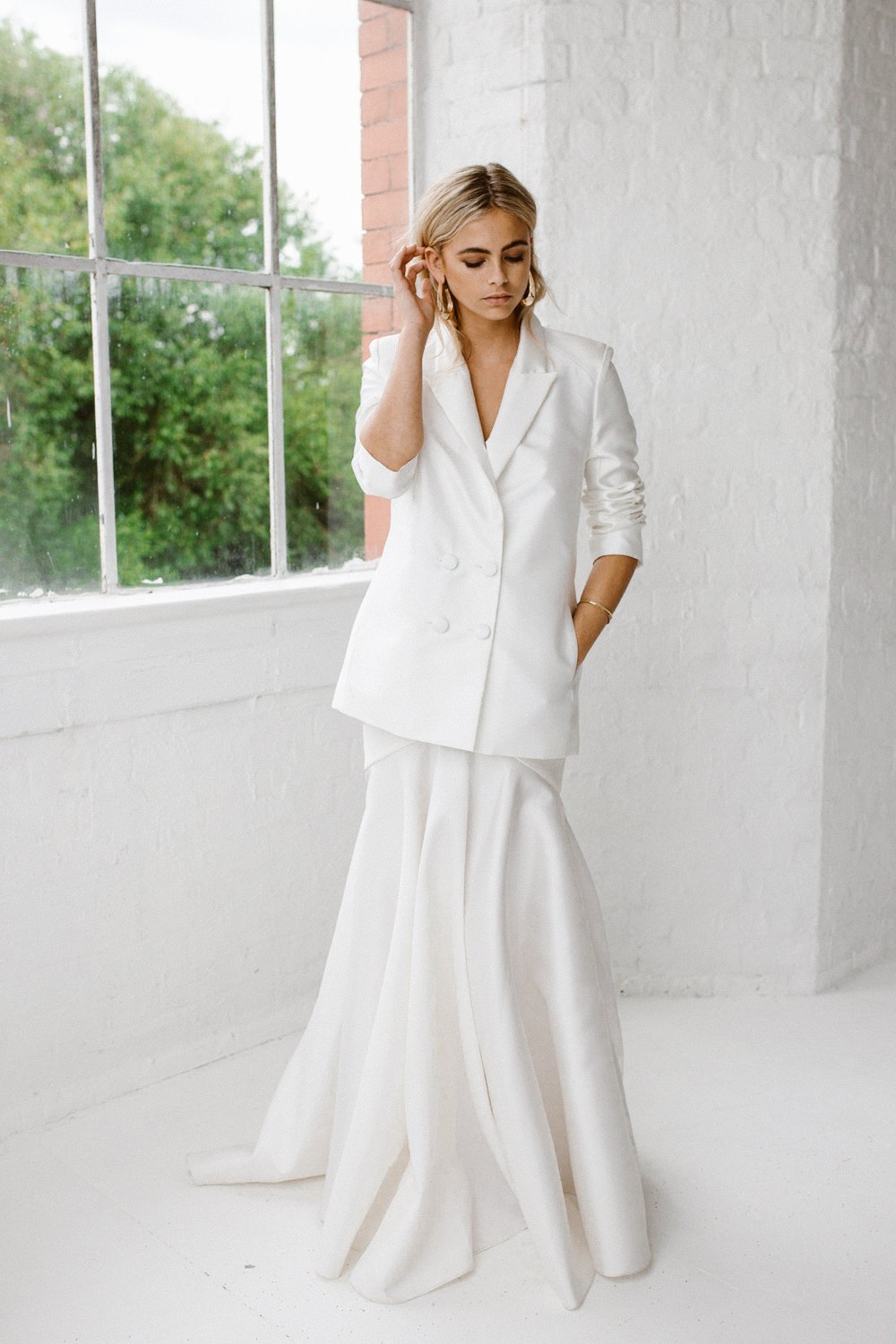 Minimalist bridal style inspiration shoot featuring wedding dresses and bridal wear by Halfpenny London