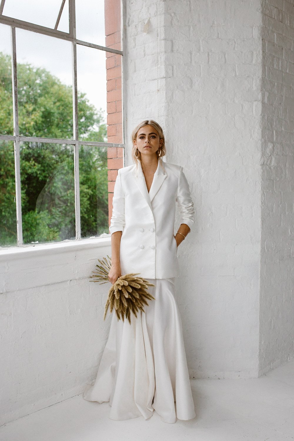 Minimalist bridal style inspiration shoot featuring wedding dresses and bridal wear by Halfpenny London