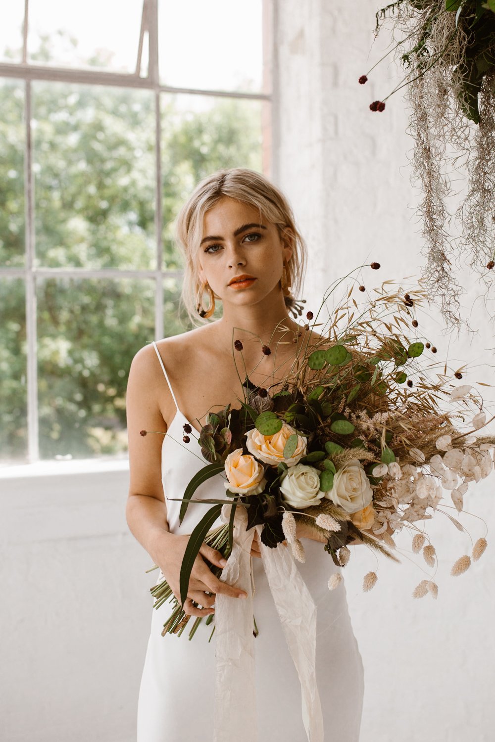 Minimalist bridal style inspiration shoot featuring wedding dresses and bridal wear by Halfpenny London