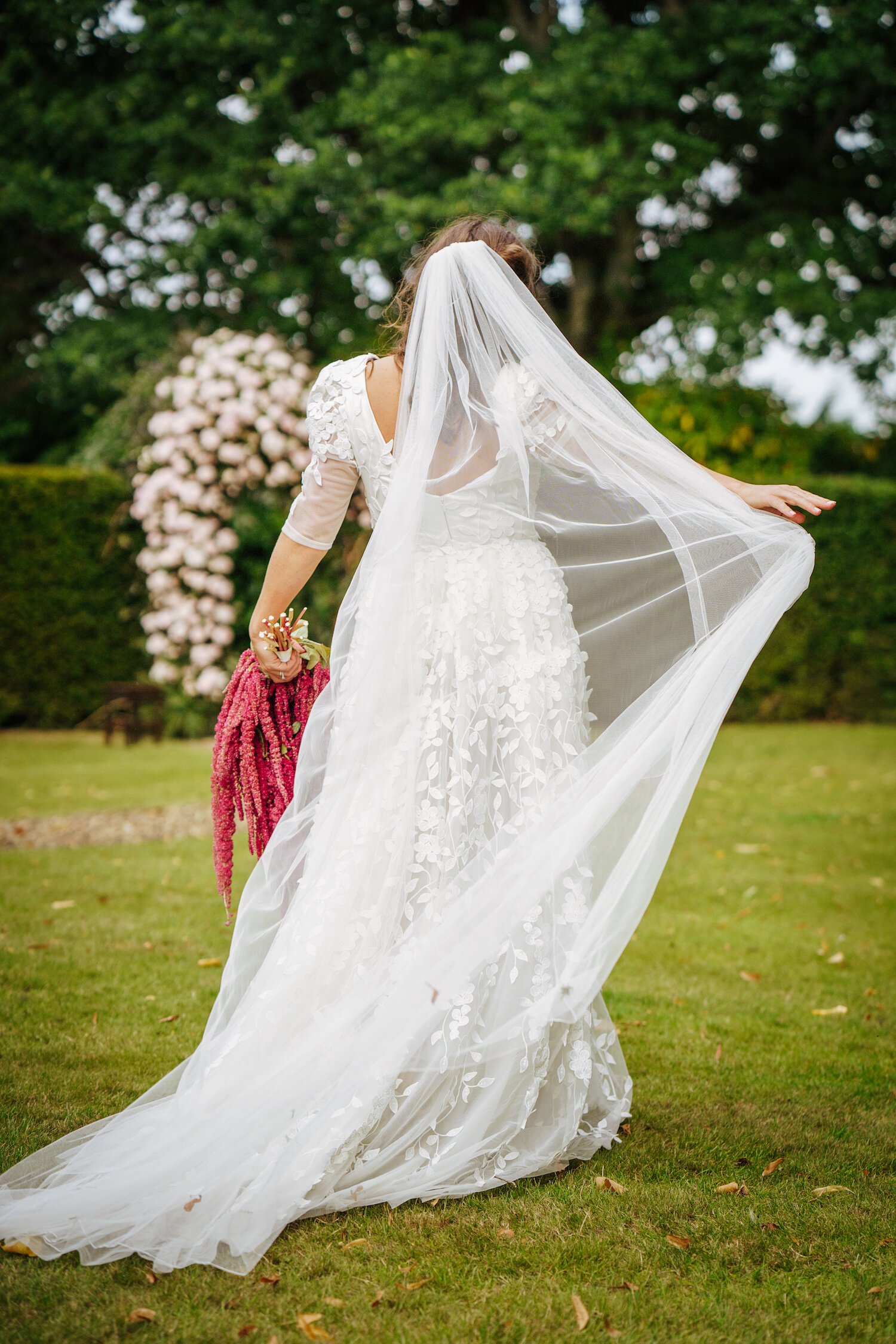 Beautiful bride Georgie wears a bespoke dress by Halfpenny London