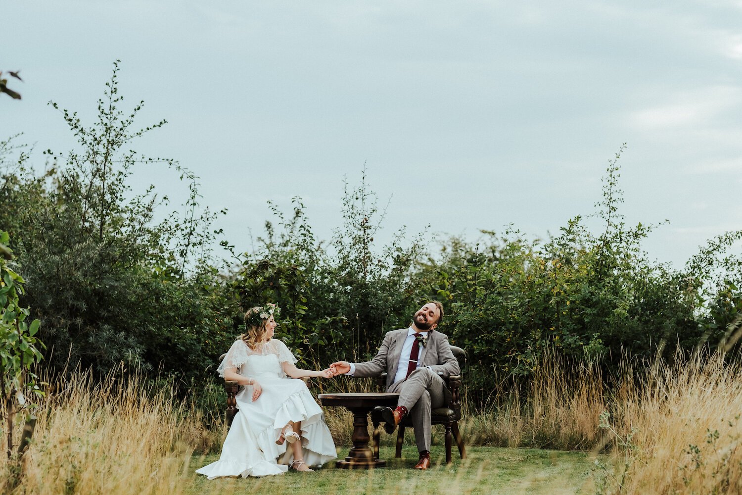 Beautiful bride Laura wears the high-low Breeze dress and Ridley top by Halfpenny London 