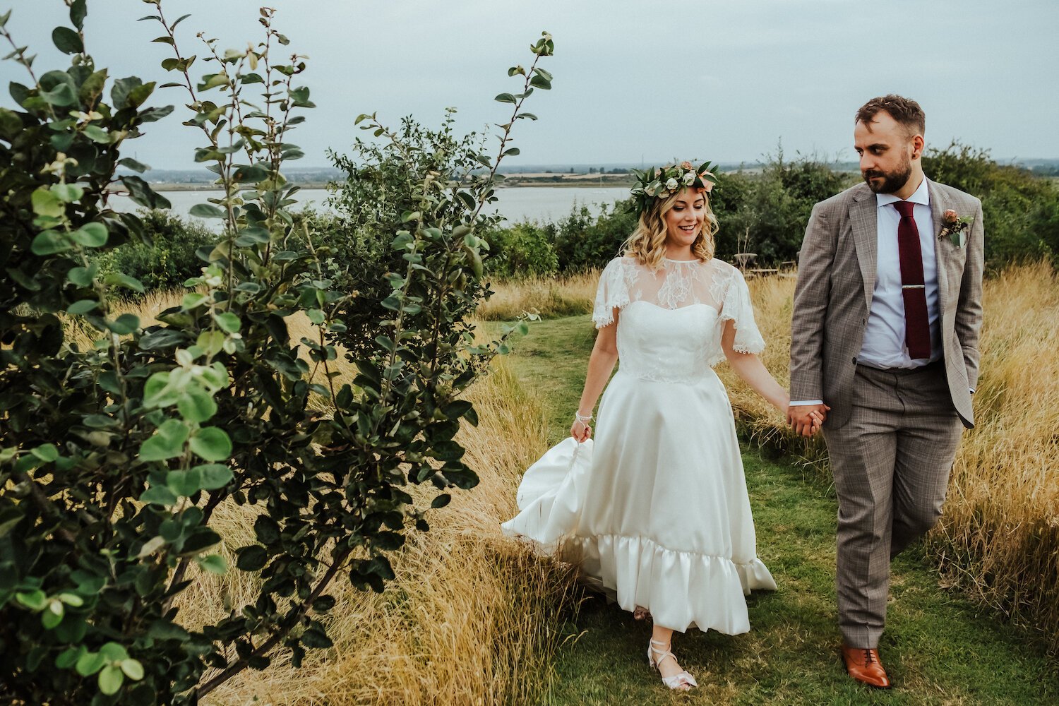 Beautiful bride Laura wears the high-low Breeze dress and Ridley top by Halfpenny London 
