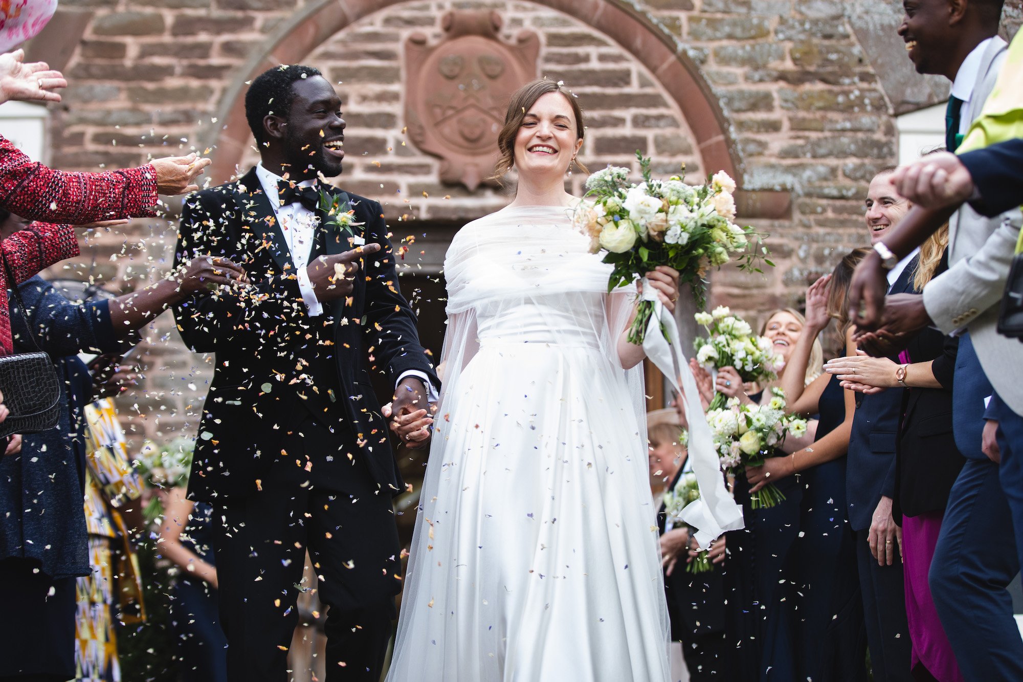 Beautiful bride Emma wore a wedding dress and cape by Halfpenny London
