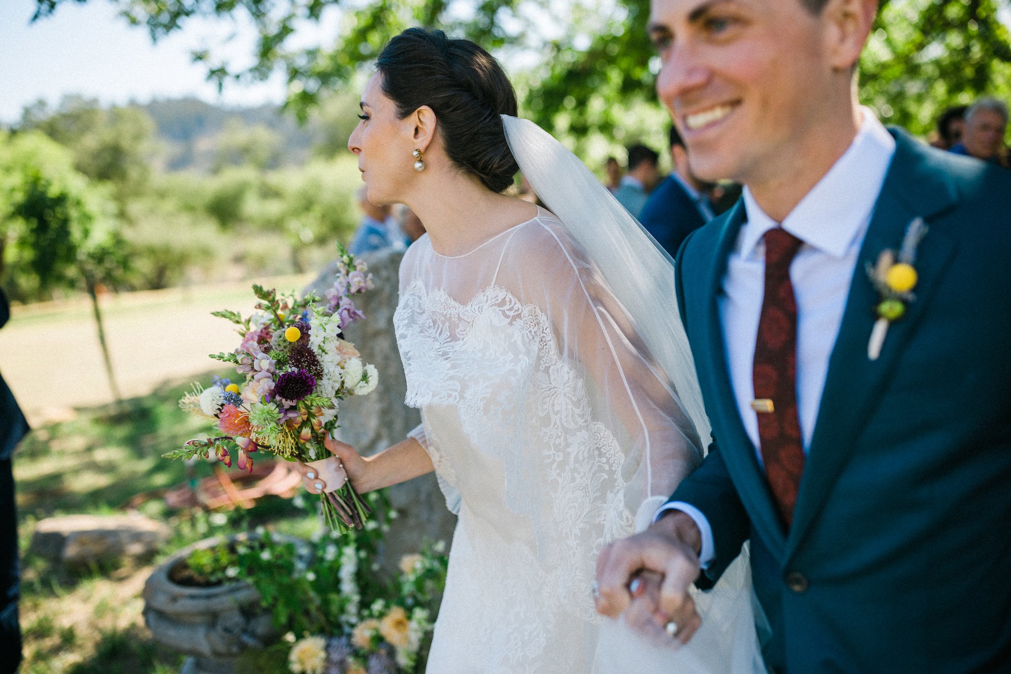 Beautiful bride Cate wore the Cliff tiered lace wedding dress by Halfpenny London