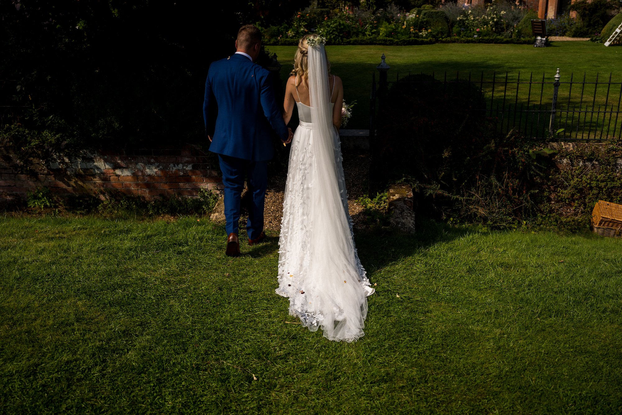 Beautiful bride Emily wore the Finsbury wedding dress and Beale overskirt by Halfpenny London on her wedding day