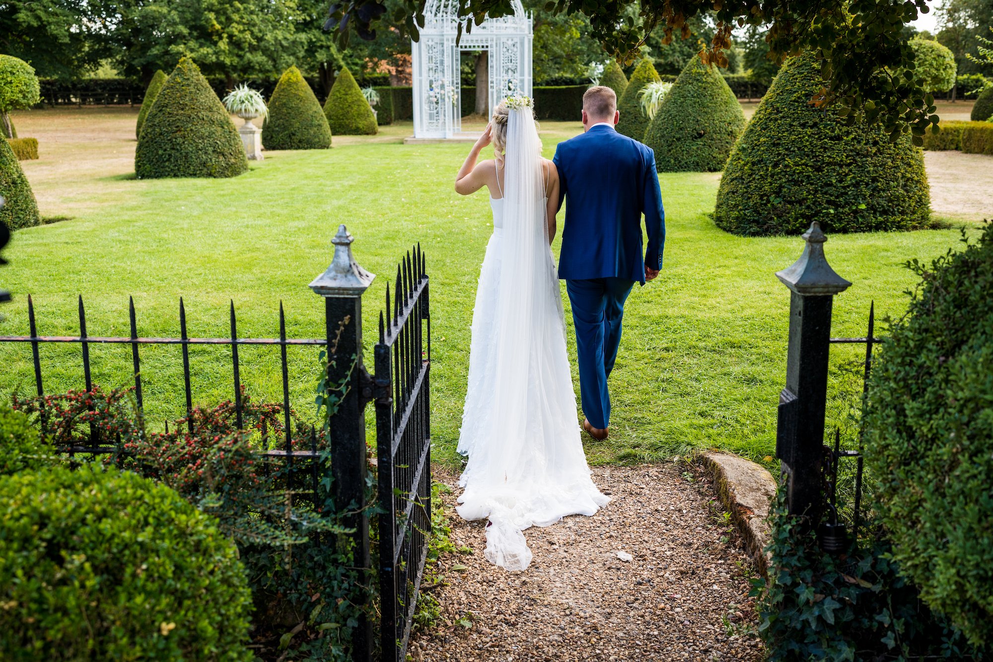 Beautiful bride Emily wore the Finsbury wedding dress and Beale overskirt by Halfpenny London on her wedding day