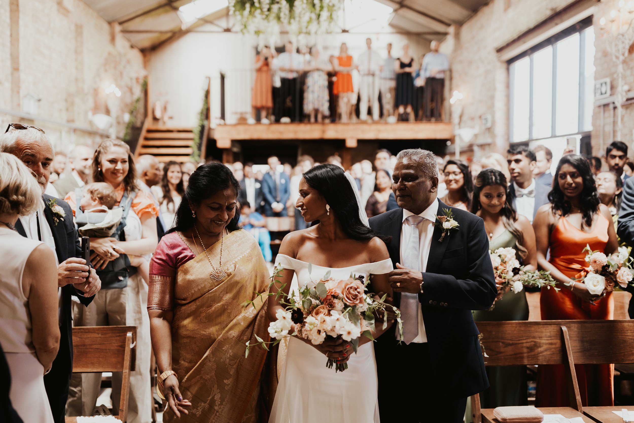 Beautiful bride Anjana wore the Harbour wedding dress and Lily overskirt by Halfpenny London 