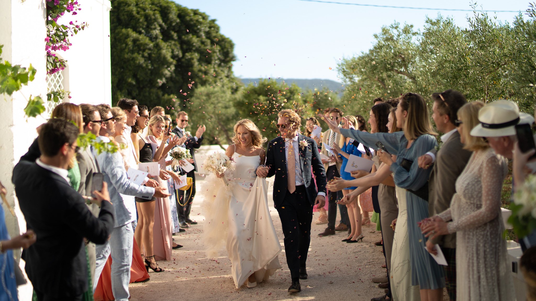 Beautiful bride Rosie wore the Thea wedding dress, Soft Dandelion veil and Ariel bow by Halfpenny London for a destination wedding in Puglia